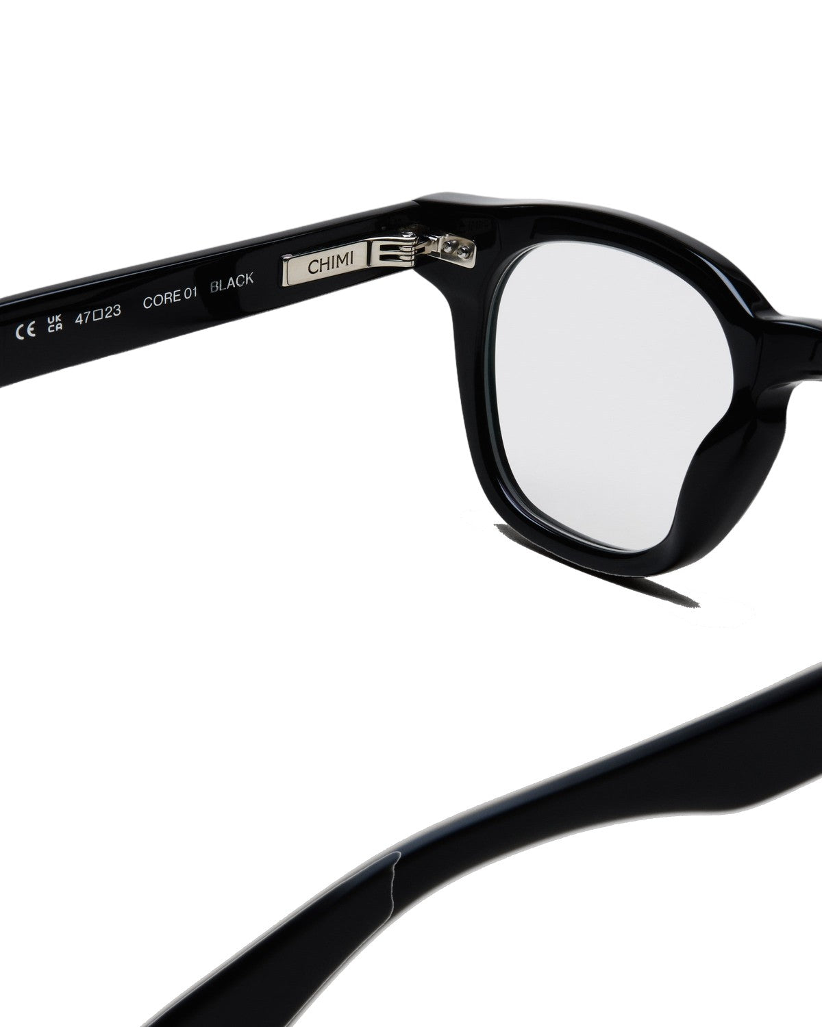 Close-up of the temple and hinge on CHIMI 01 Core Black Clear eyeglasses.