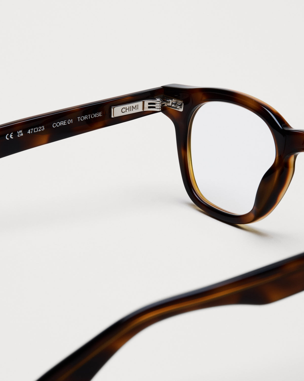 Close-up of the frame and hinge details on CHIMI 01 Core Tortoise Clear Eyeglasses