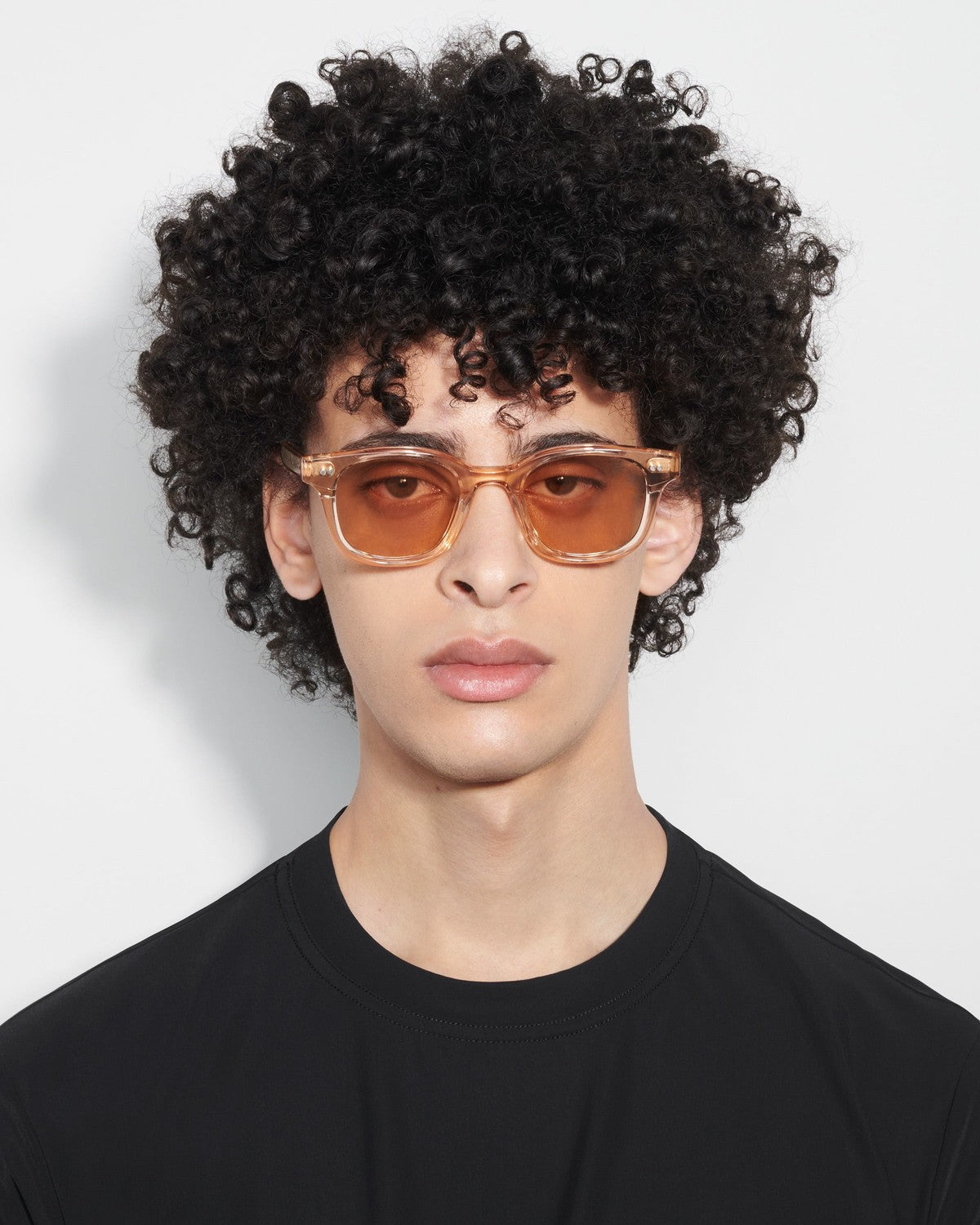 Model wearing CHIMI 02 Light Orange sunglasses.
