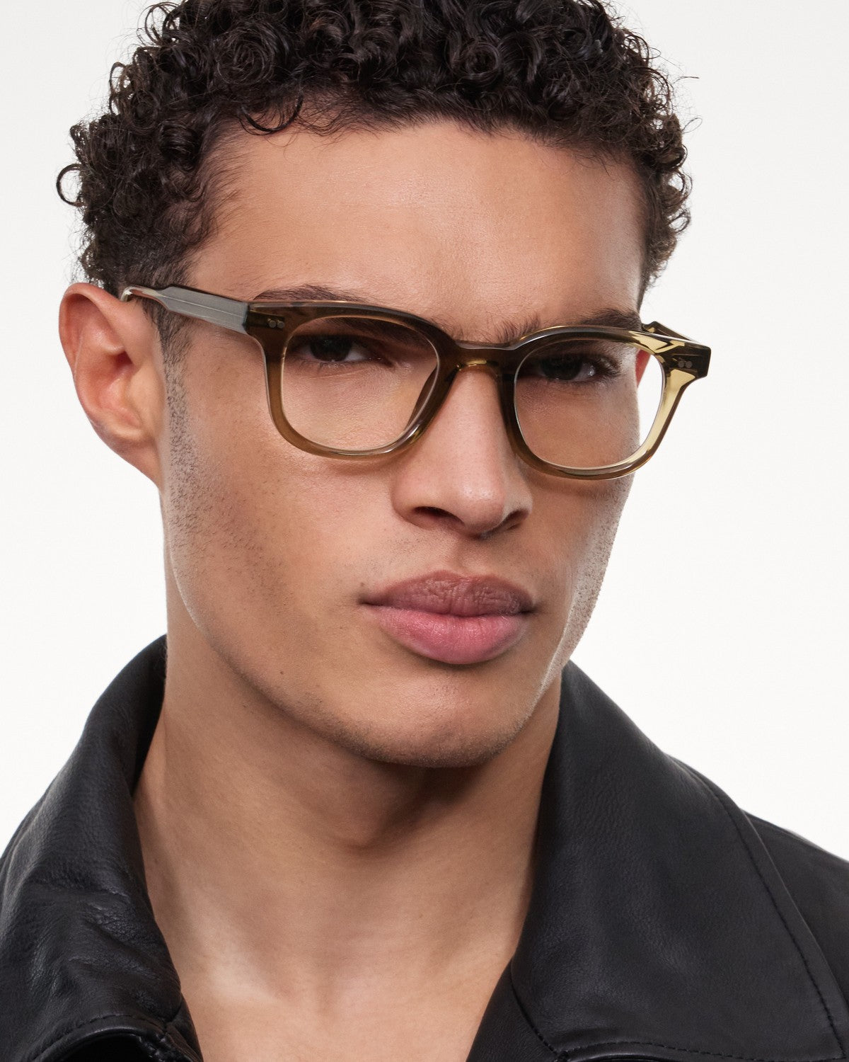 Angled view of model wearing CHIMI 02 Core Green Clear eyeglasses.