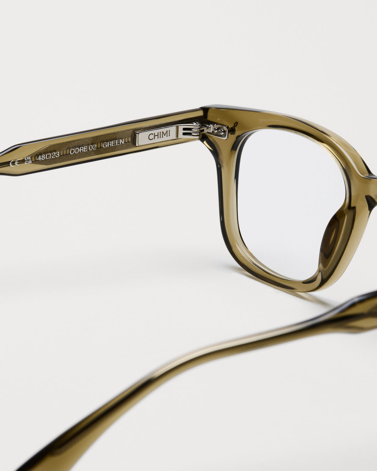Close-up of the frame and hinge details on CHIMI 02 Core Green Clear Eyeglasses