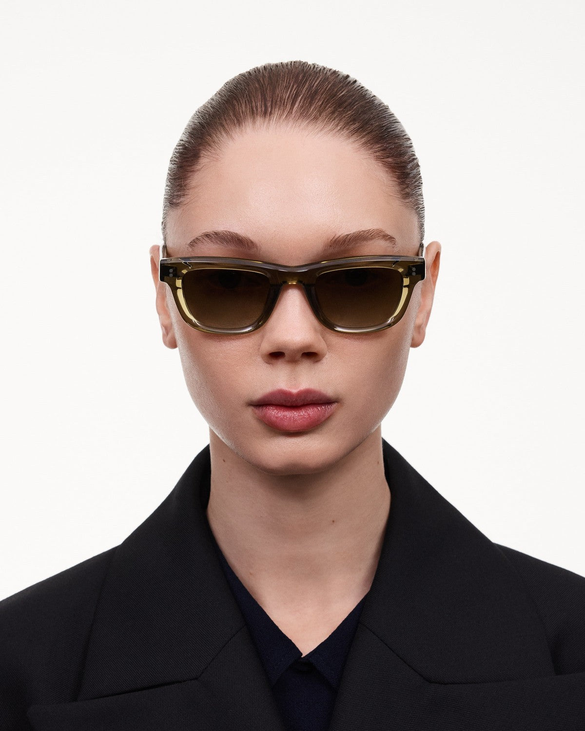 Model wearing CHIMI 08 Green sunglasses, front view.