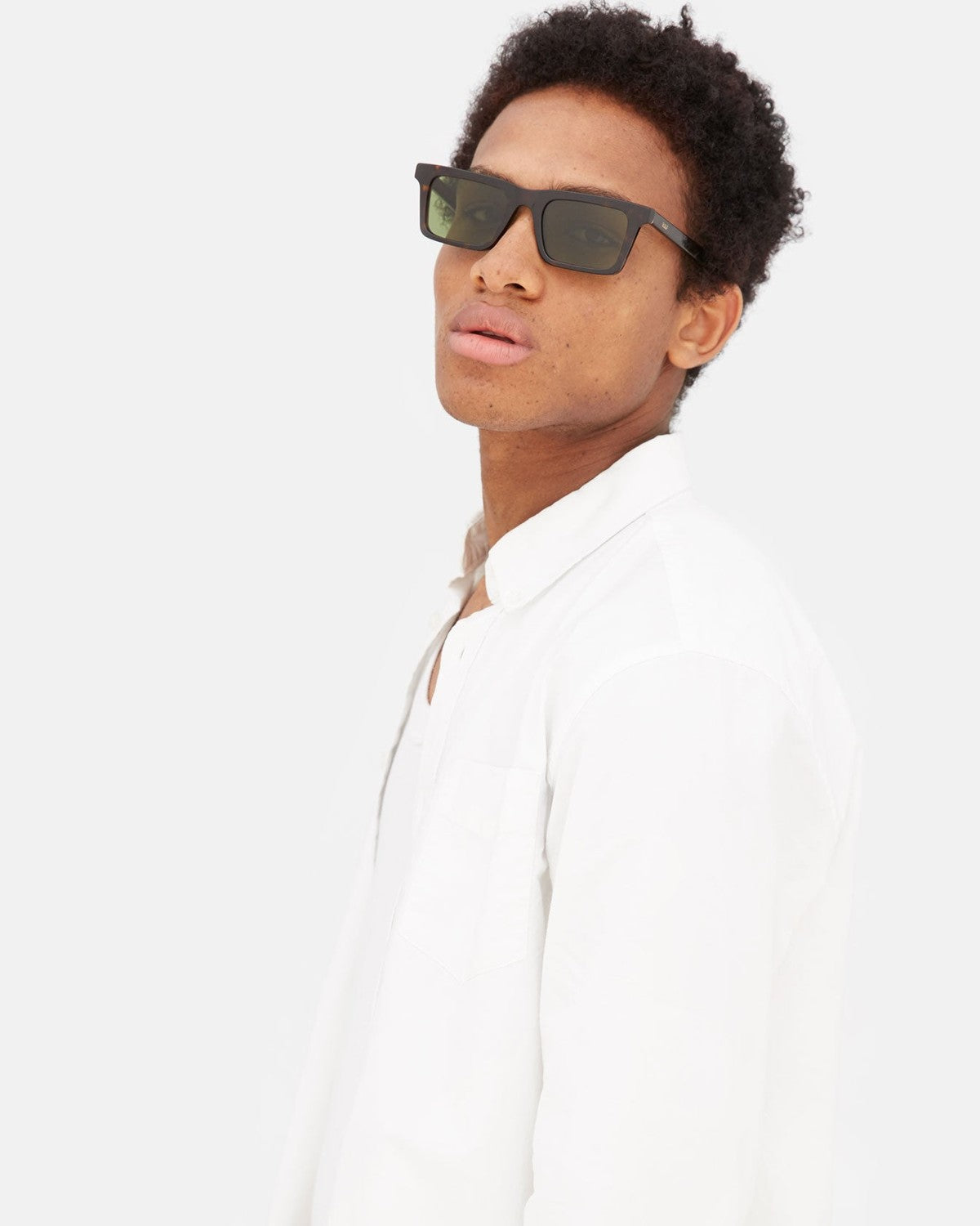 Model wearing RETROSUPERFUTURE 1968 3627 sunglasses in profile.