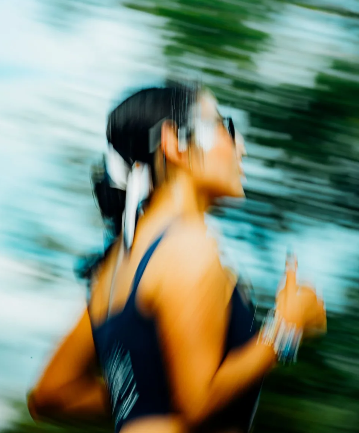 Person running outdoors with a blurred background