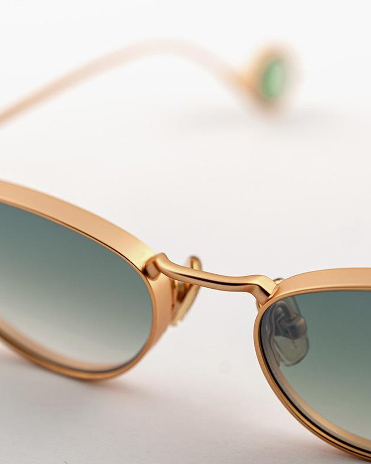 Close-up of the bridge and metal frame detail on EYEPETIZER ALAMEDA C.4-25F sunglasses.