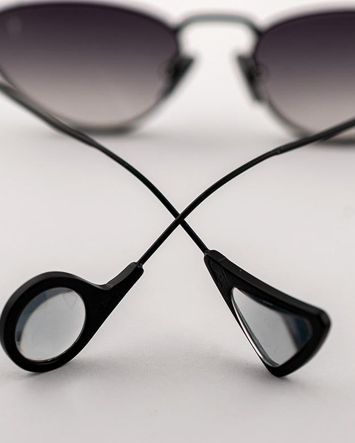 Detail of the sculptural temple tips on EYEPETIZER ALAMEDA C.6-27F sunglasses.