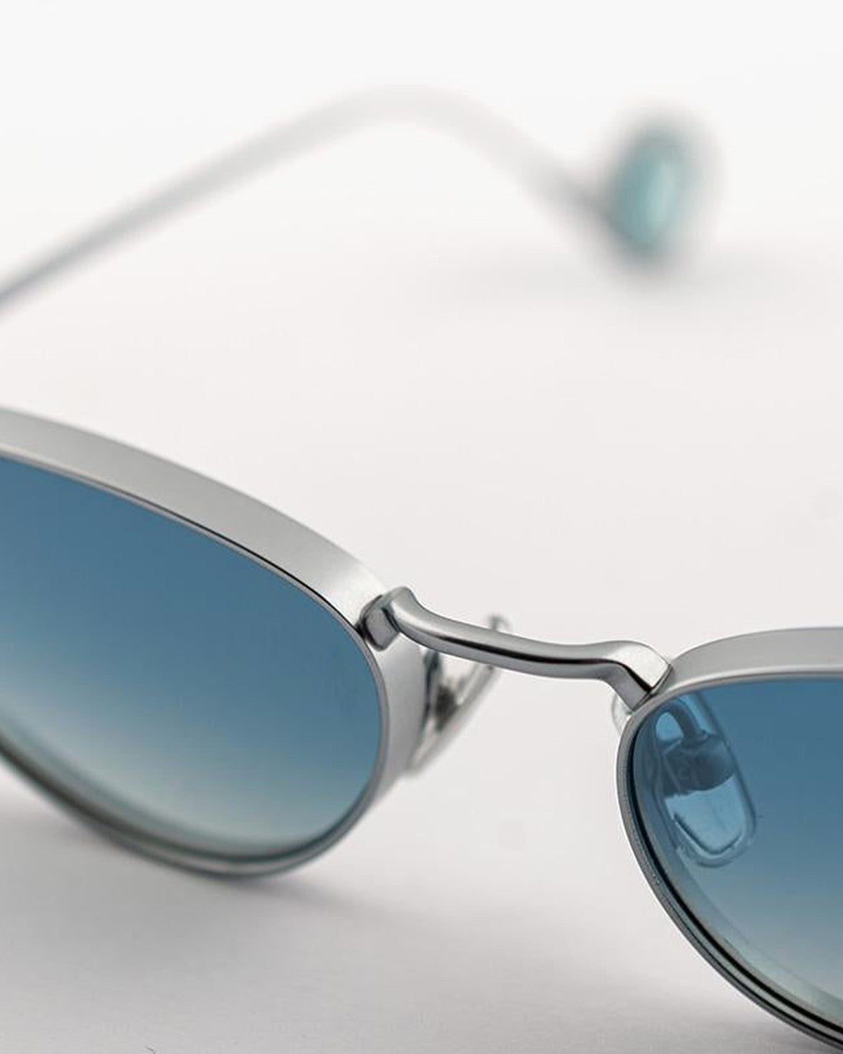Close-up of the bridge and metal frame construction on EYEPETIZER ALAMEDA C.1-26F sunglasses.