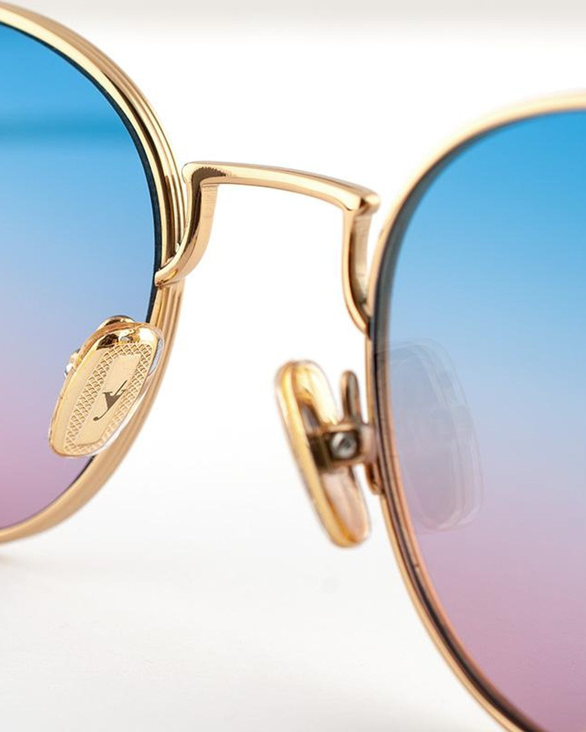 Close-up of the bridge and brand plaque on EYEPETIZER ALEN C.4-42F sunglasses.