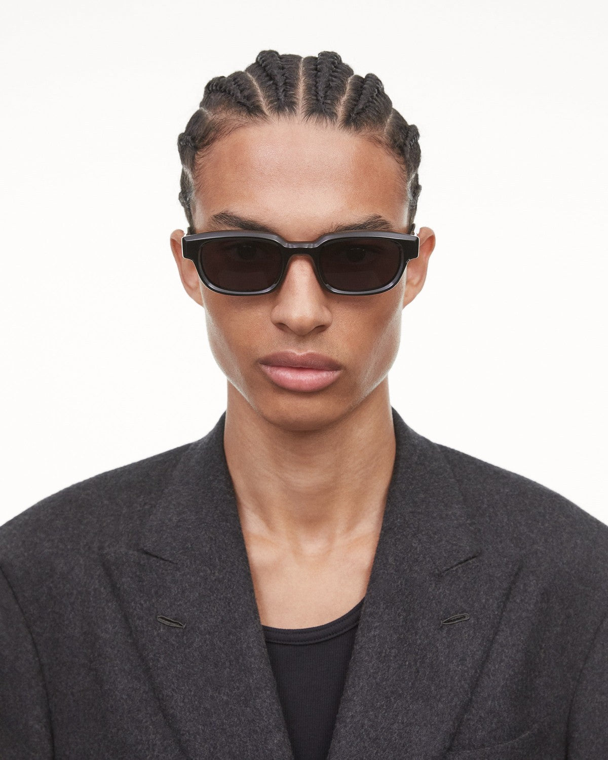 Model wearing CHIMI Alter Black sunglasses, front view.