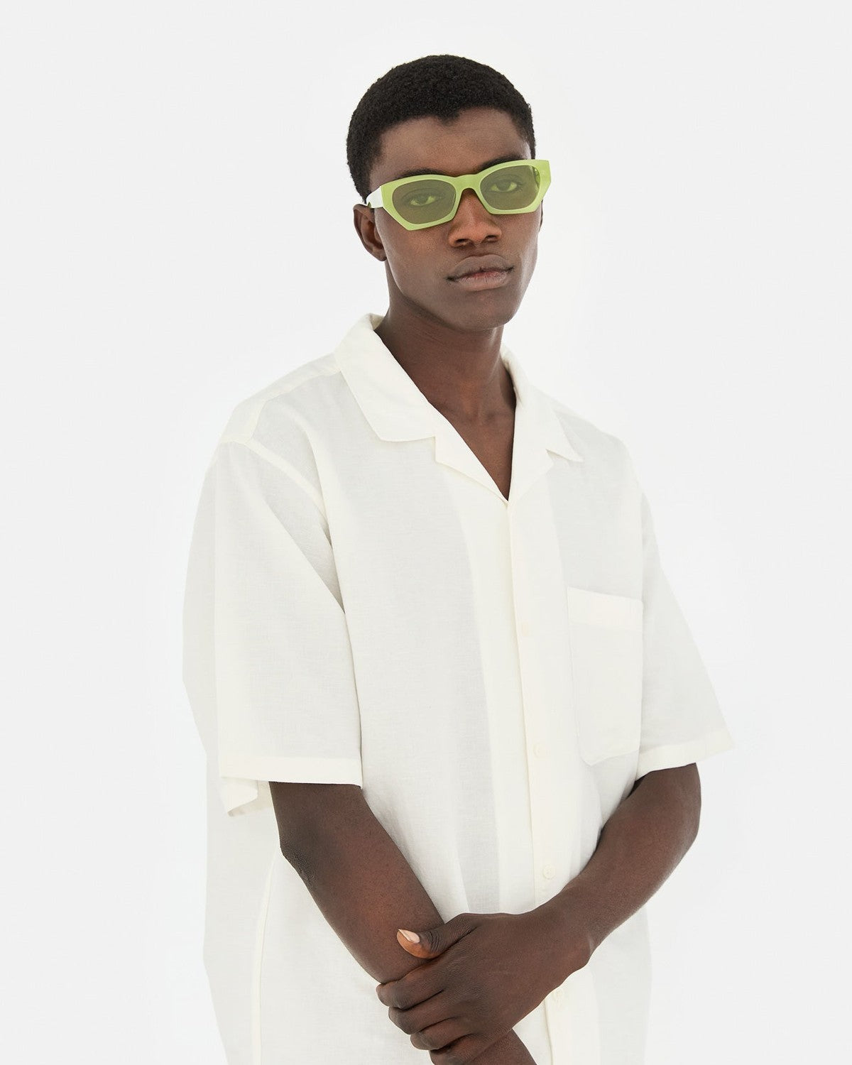 Model wearing RETROSUPERFUTURE Amata Estate Menta sunglasses in a white shirt.