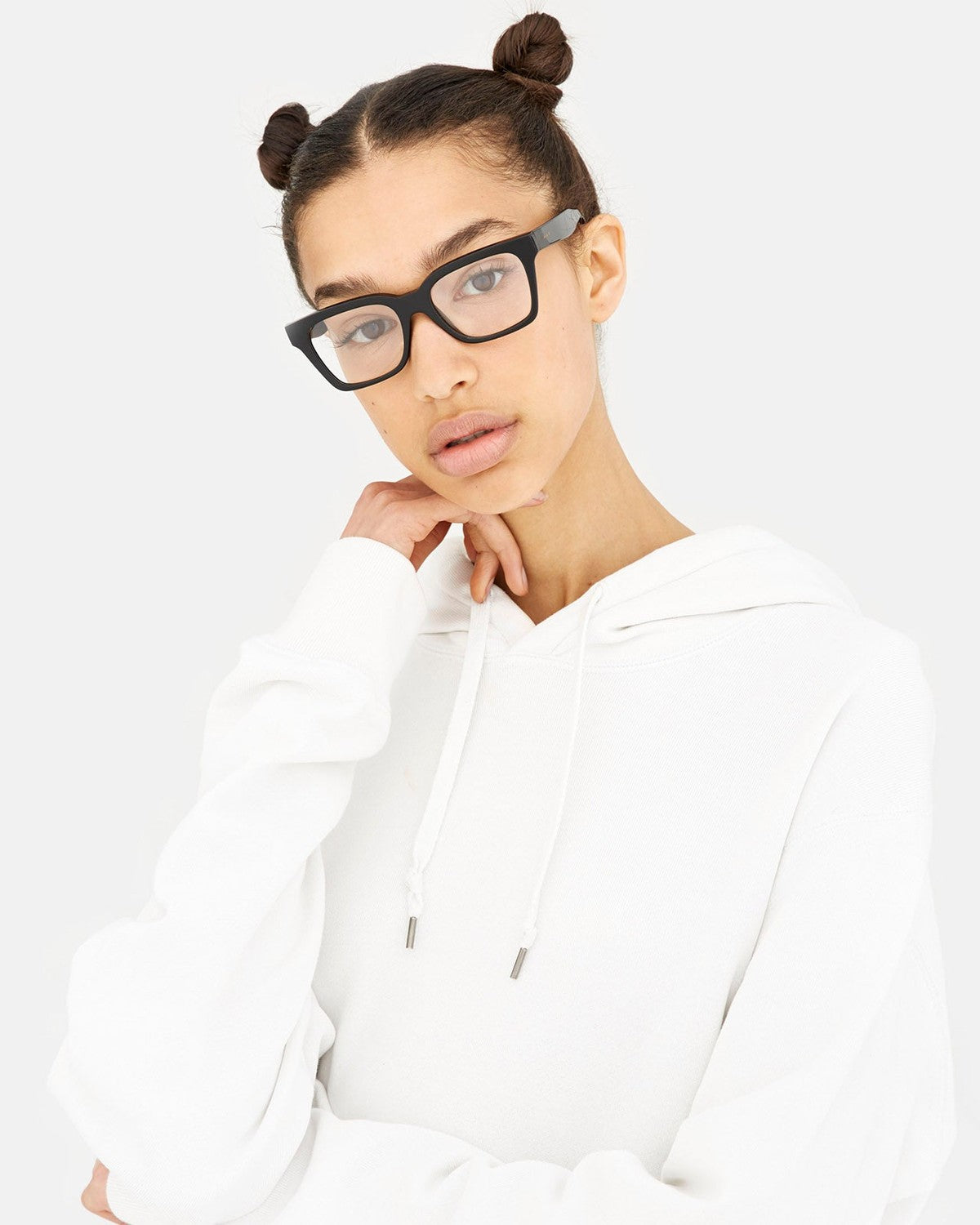 Model wearing RETROSUPERFUTURE America Nero eyeglasses with a white hoodie.