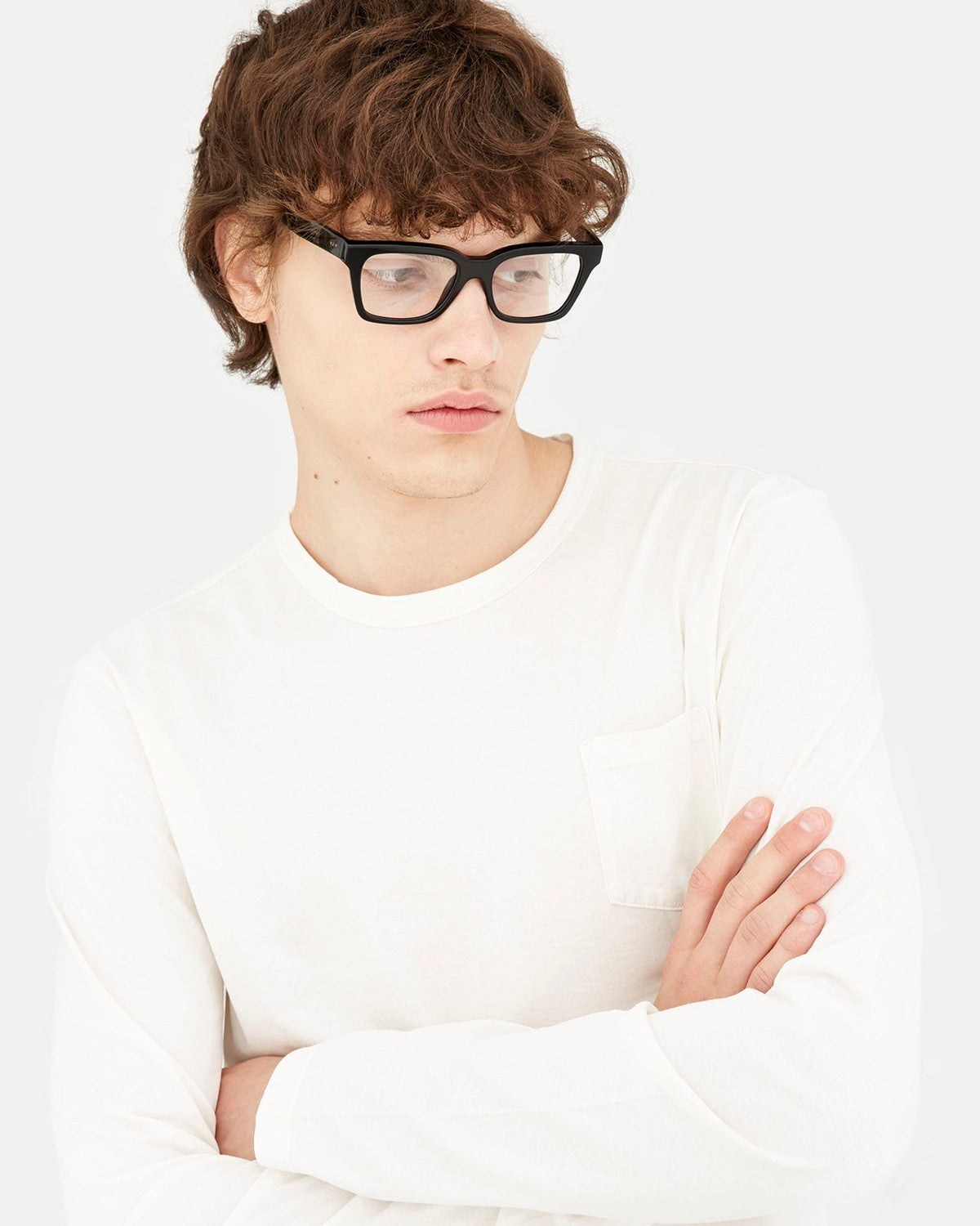Male model wearing RETROSUPERFUTURE America Nero eyeglasses with a white shirt.