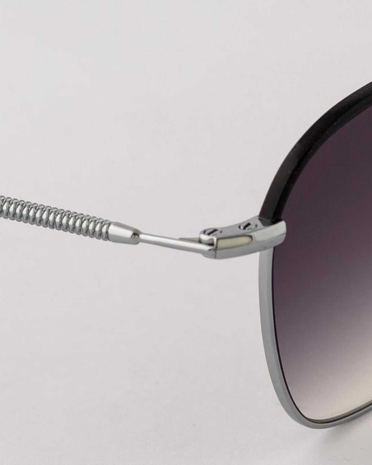 Close-up of the spring hinge and cable temple on EYEPETIZER ATACAMA C.1-A-27 sunglasses.