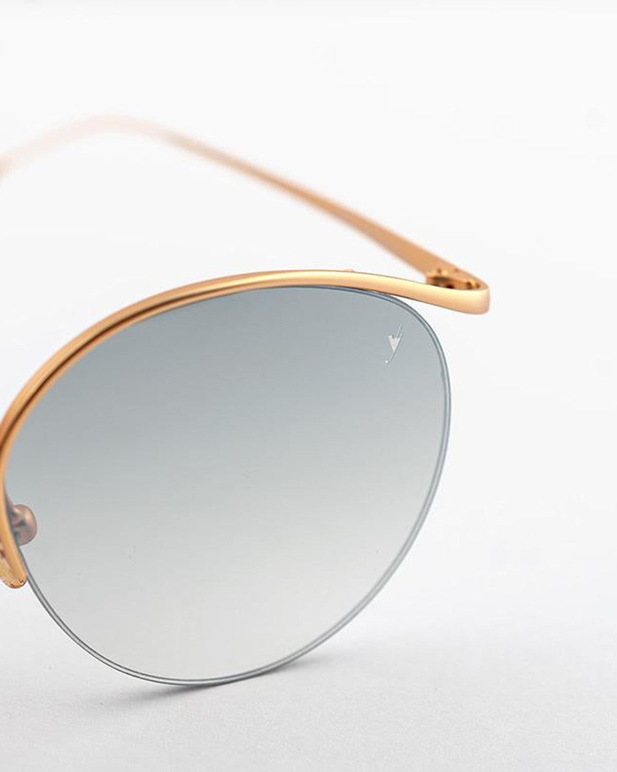 Angled detail of the left lens and gold-tone rim on EYEPETIZER AUGUSTO C.4-OP-25F sunglasses.