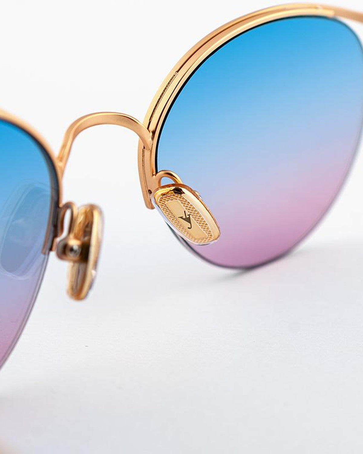 Detail of the ornamental temple tip and hinge on EYEPETIZER AUGUSTO C.4-OP-42F sunglasses.