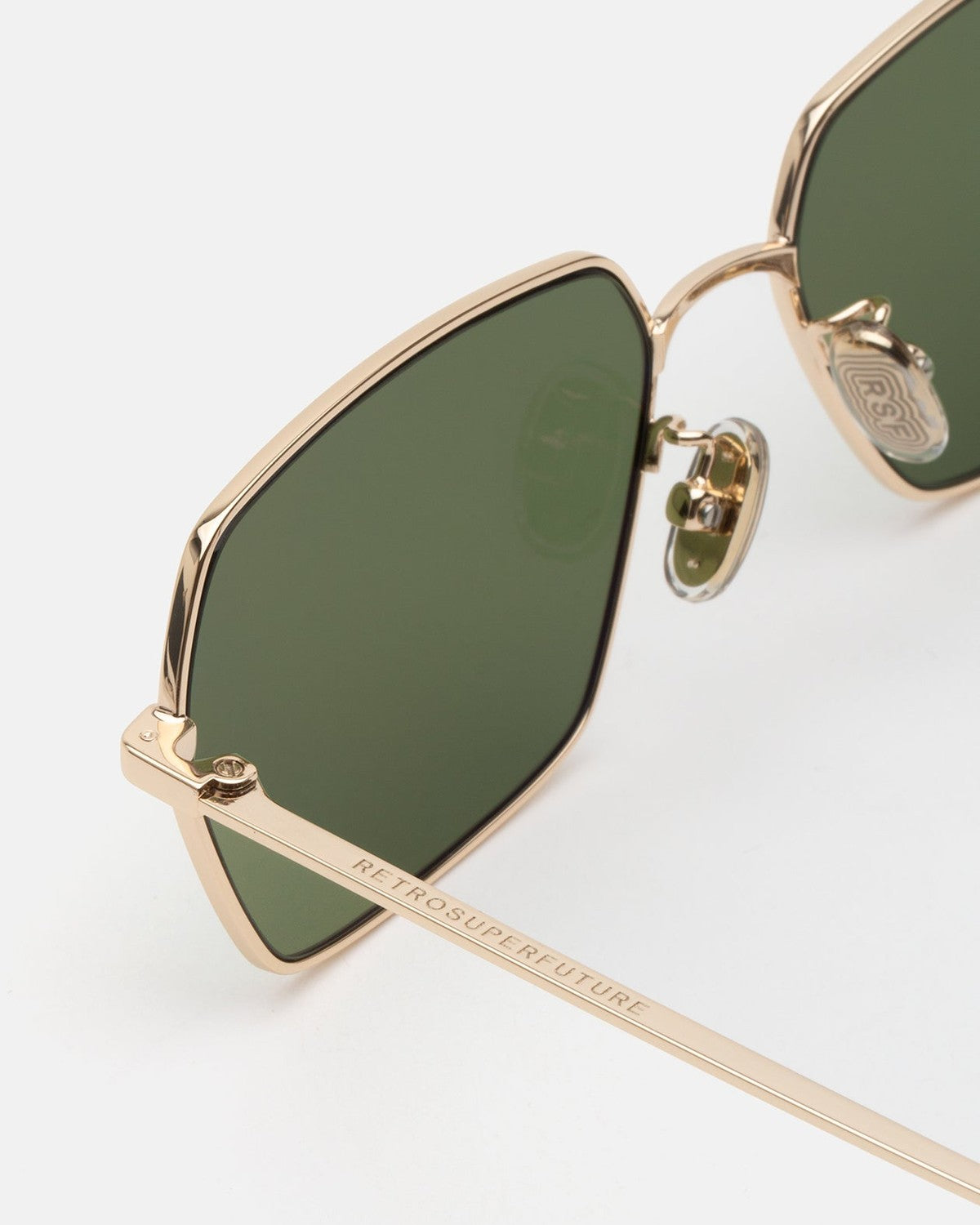 Close-up of the temple and hinge detail on RETROSUPERFUTURE Balarm Classico sunglasses.