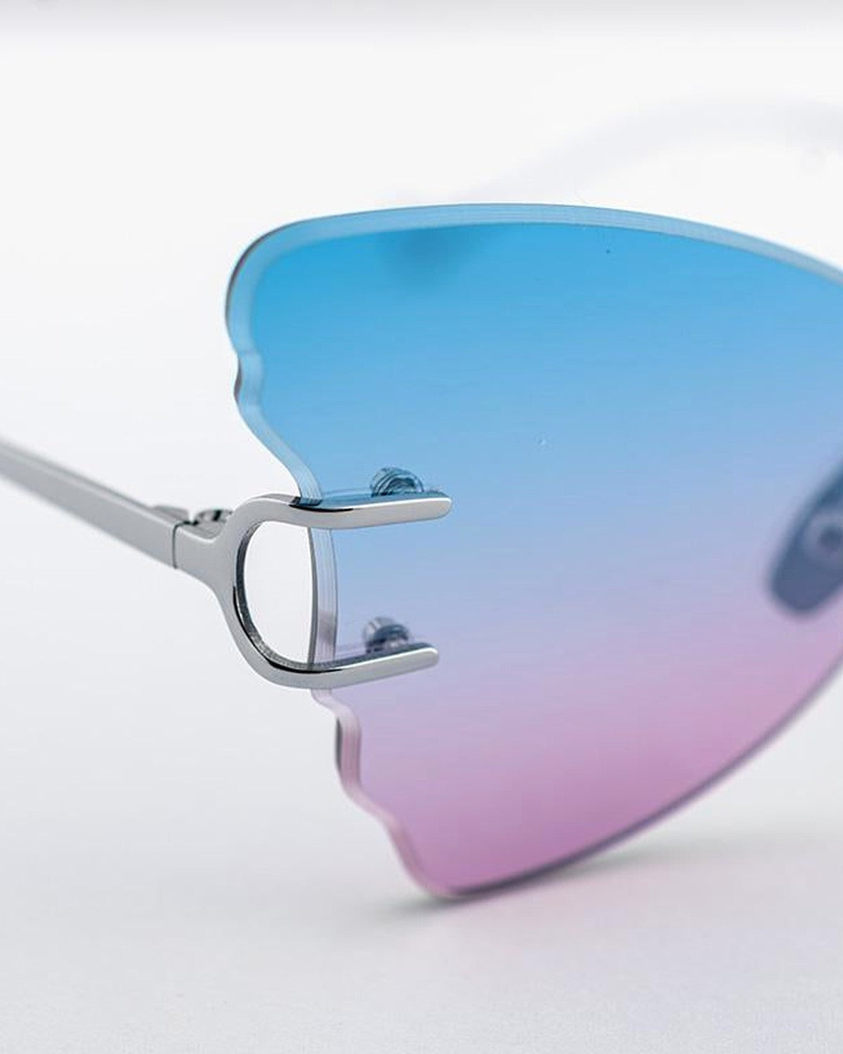 Close-up of the temple attachment and lens detail on EYEPETIZER BEAT C.1-42F sunglasses.