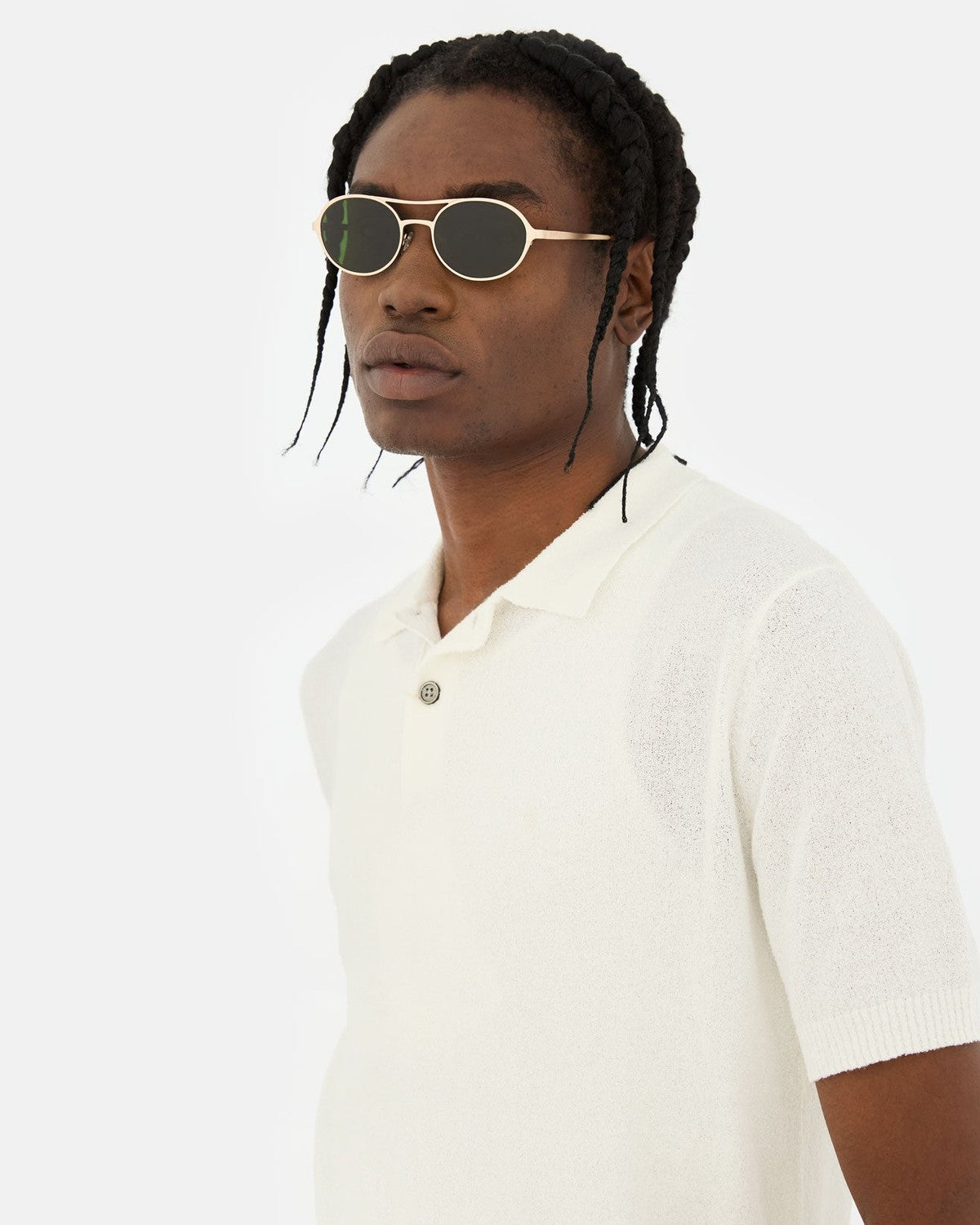Model wearing RETROSUPERFUTURE Bird Classics sunglasses in profile.