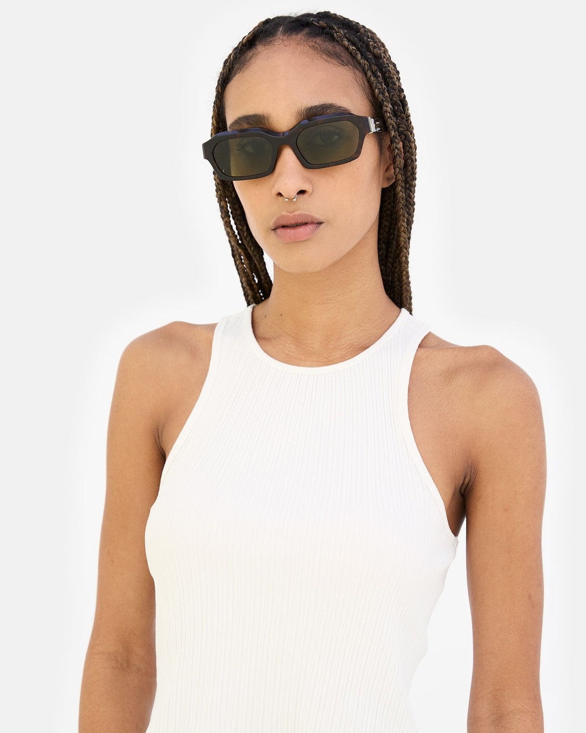 Model wearing RETROSUPERFUTURE Boletus 3627 sunglasses with braids and white tank top, facing forward.