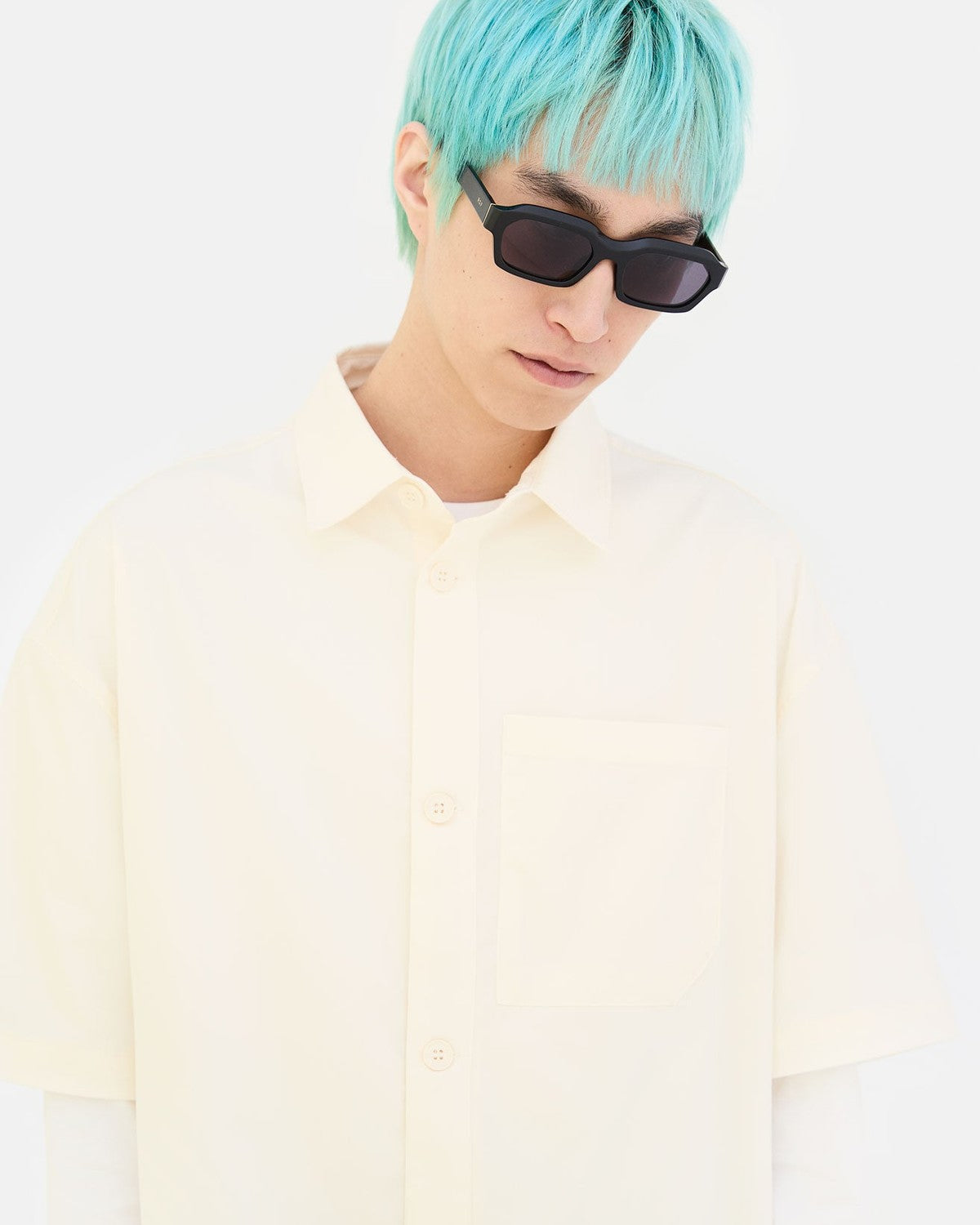 Model wearing RETROSUPERFUTURE Boletus Black sunglasses, angled view.