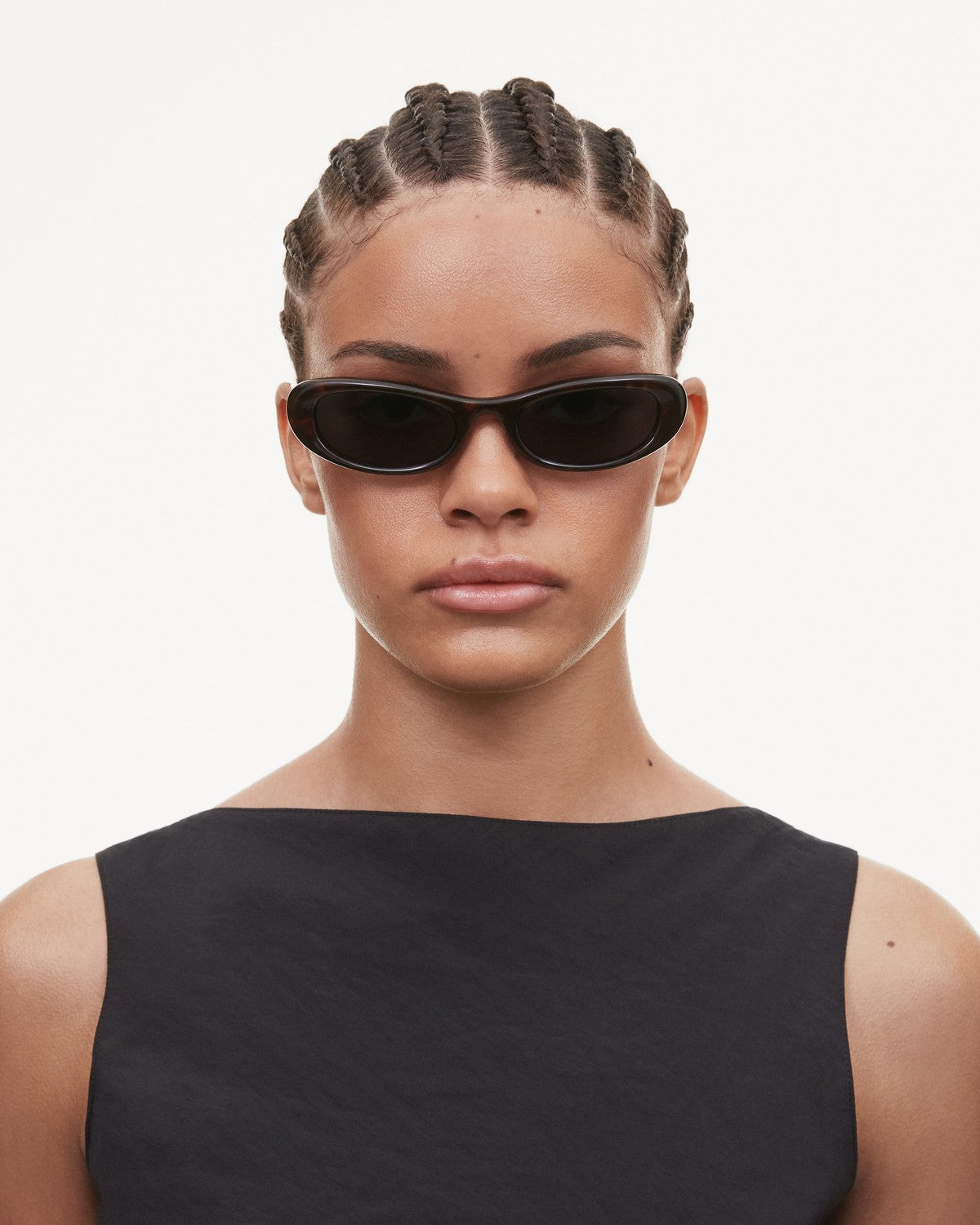 Model wearing CHIMI Bow Tortoise Green sunglasses.