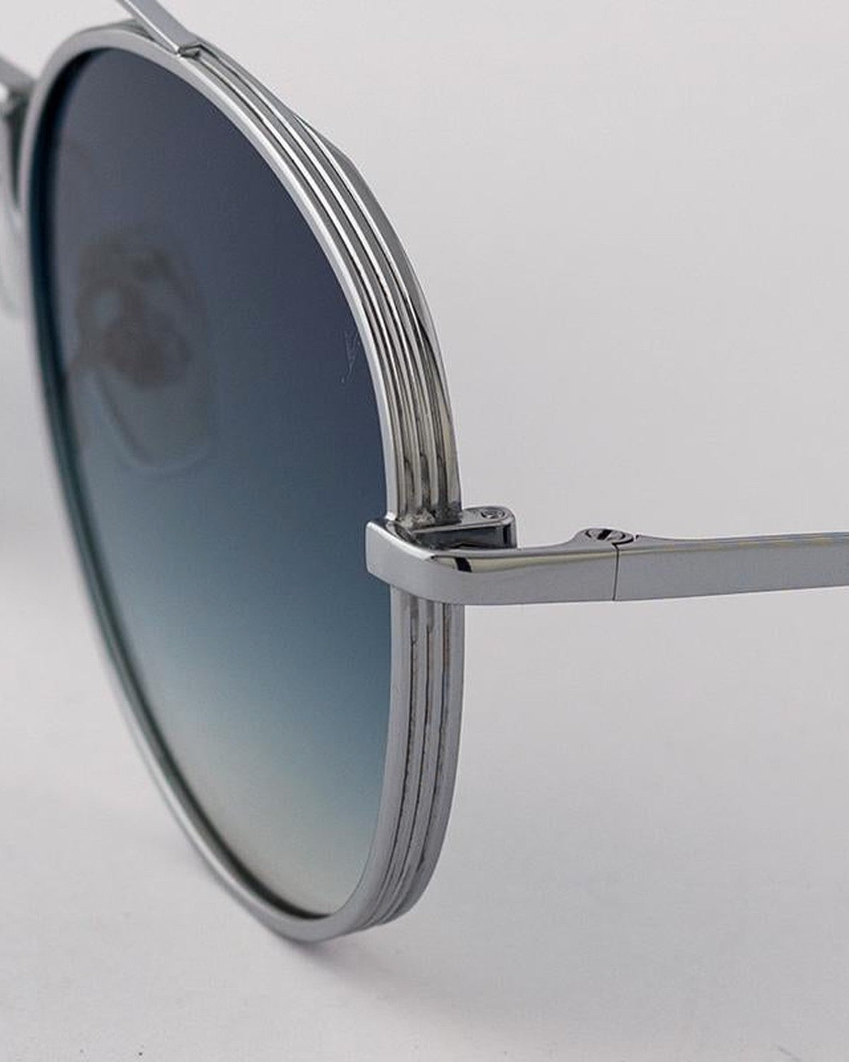 Close-up of the layered metal frame and hinge on EYEPETIZER BUILD C.1-26 sunglasses.