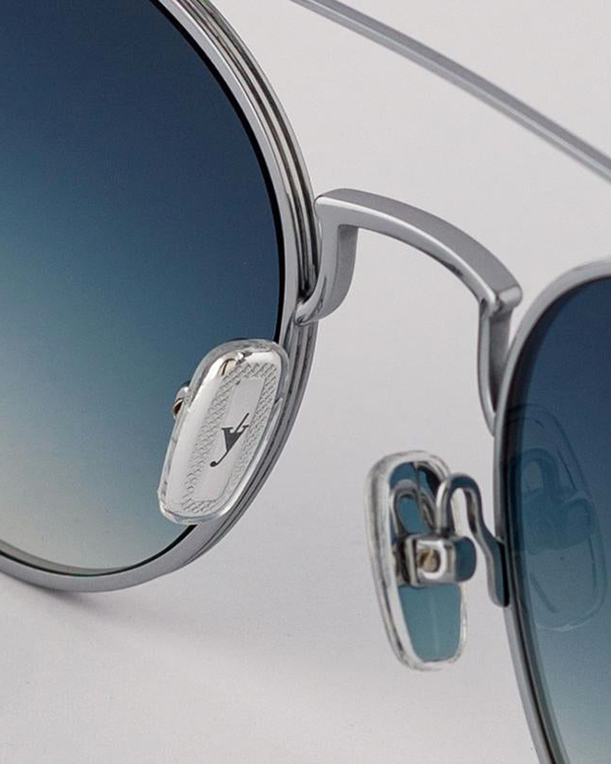 Detail of the engraved temple badge on EYEPETIZER BUILD C.1-26 sunglasses.