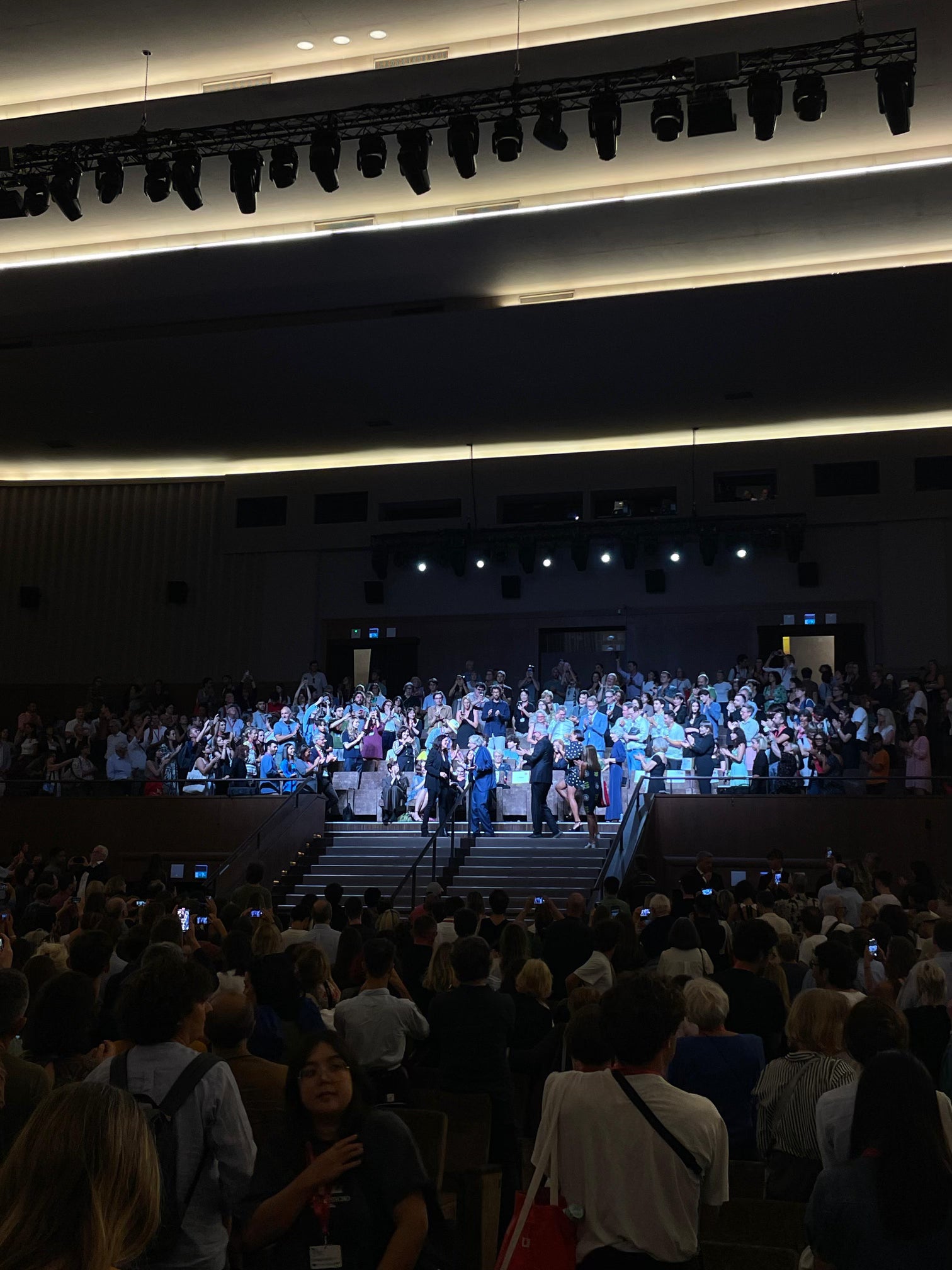 Large auditorium with a stage and audience