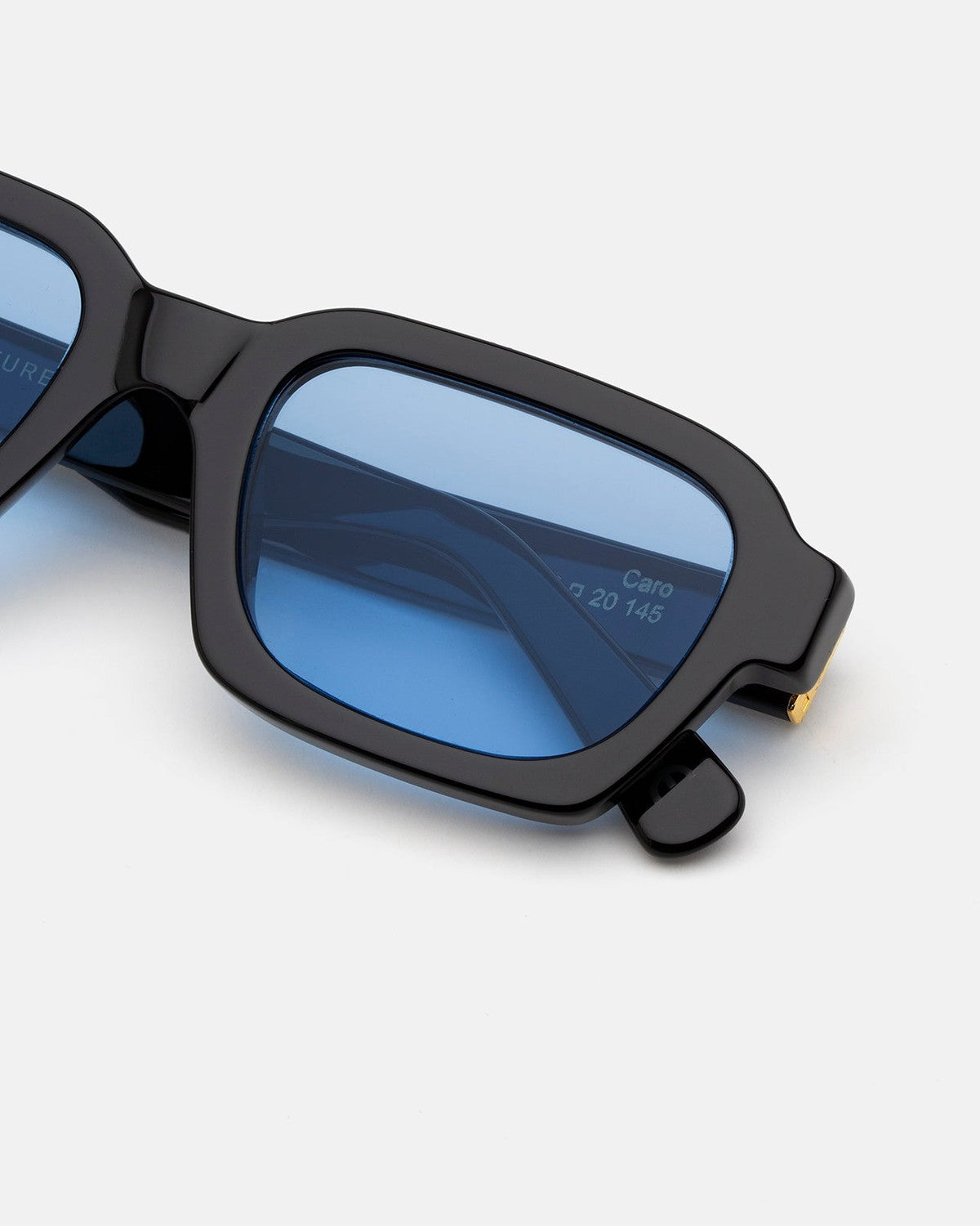 Close-up of the temple hinge and blue lenses on RETROSUPERFUTURE Caro Azure sunglasses.