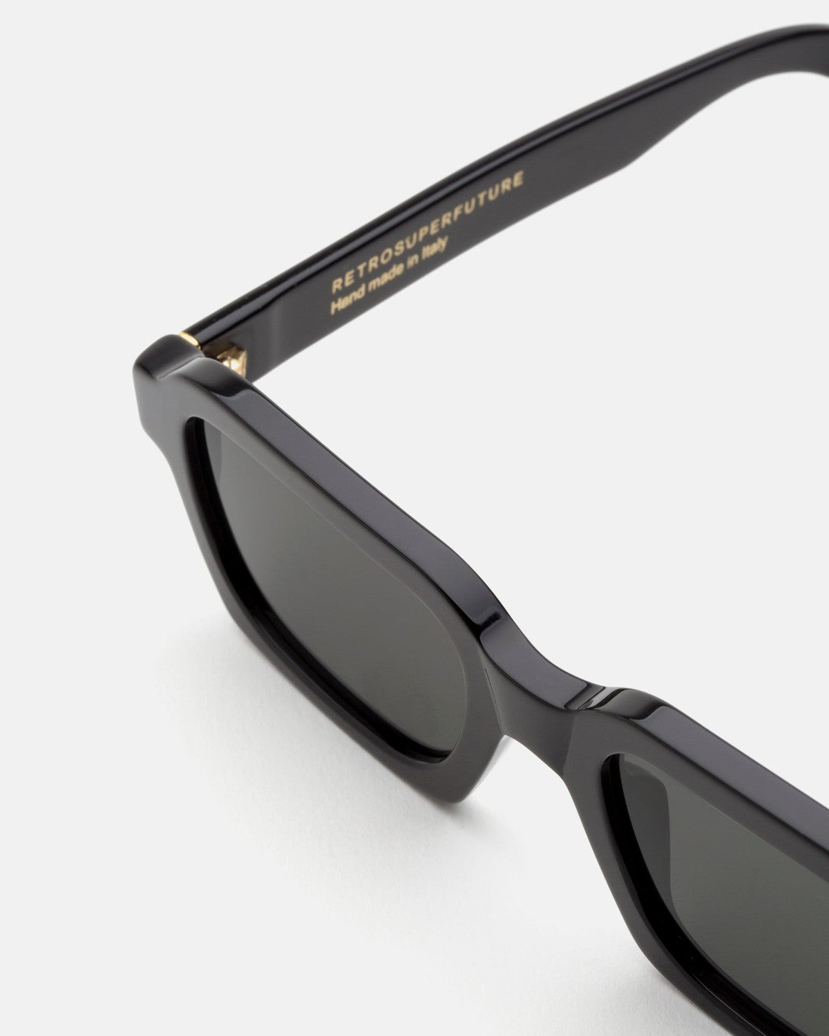 Close-up of the temple and hinge on RETROSUPERFUTURE Caro Black sunglasses.