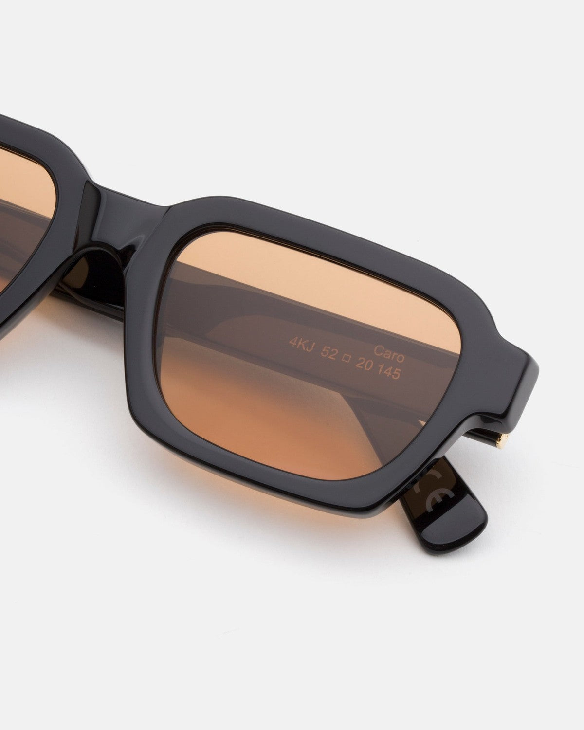 Close-up of the rectangular lens and hinge detail on RETROSUPERFUTURE Caro Refined sunglasses.