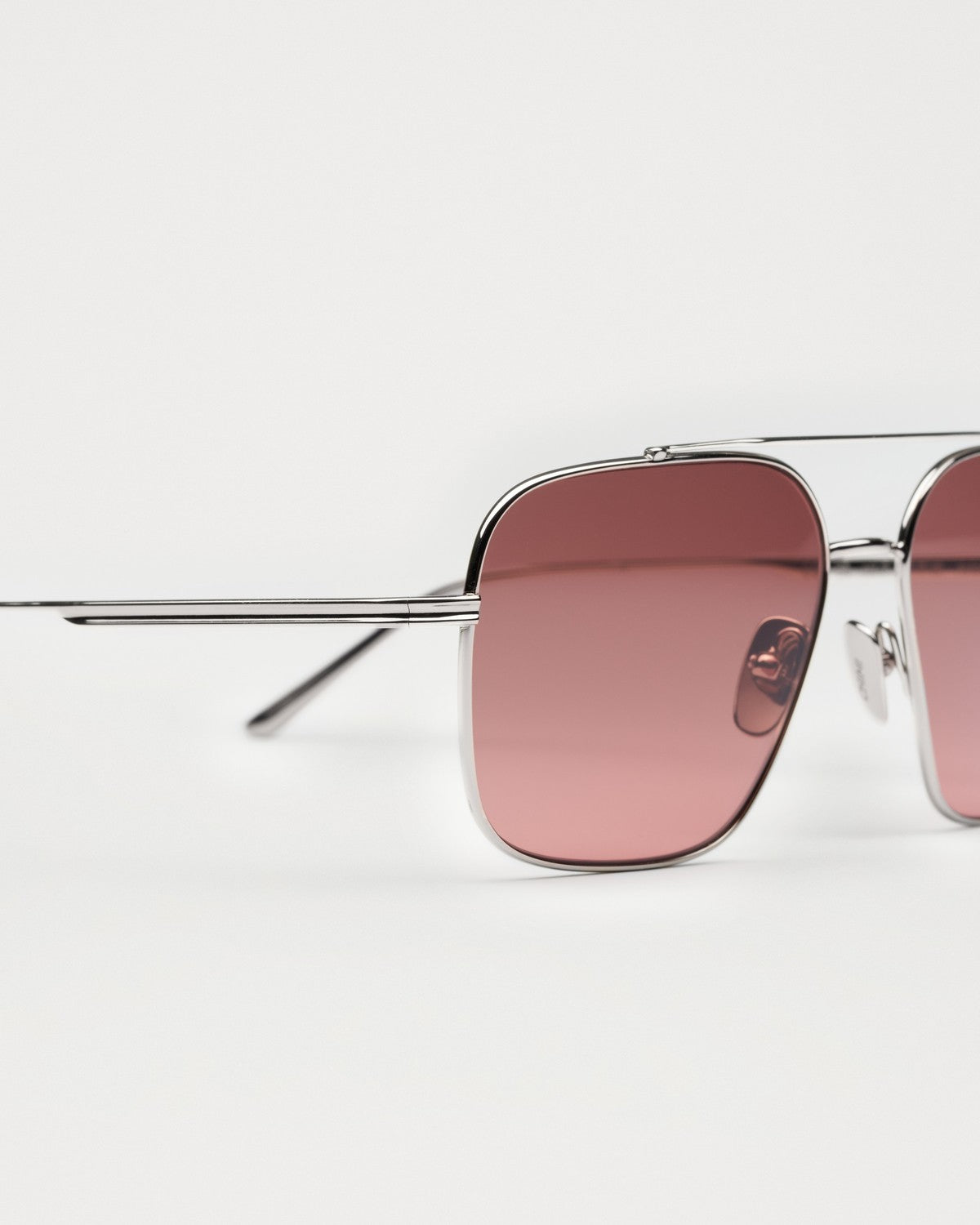 Close-up of the thin metal temples on CHIMI CC Titan Aviator Silver Medium sunglasses.