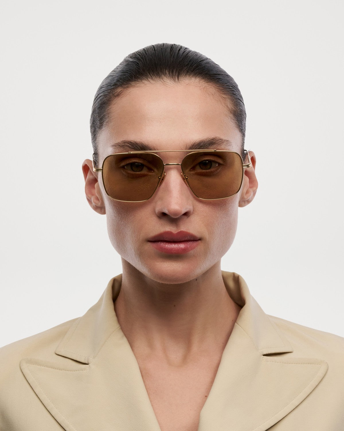 Model wearing CHIMI CC Titan Aviator Gold sunglasses.