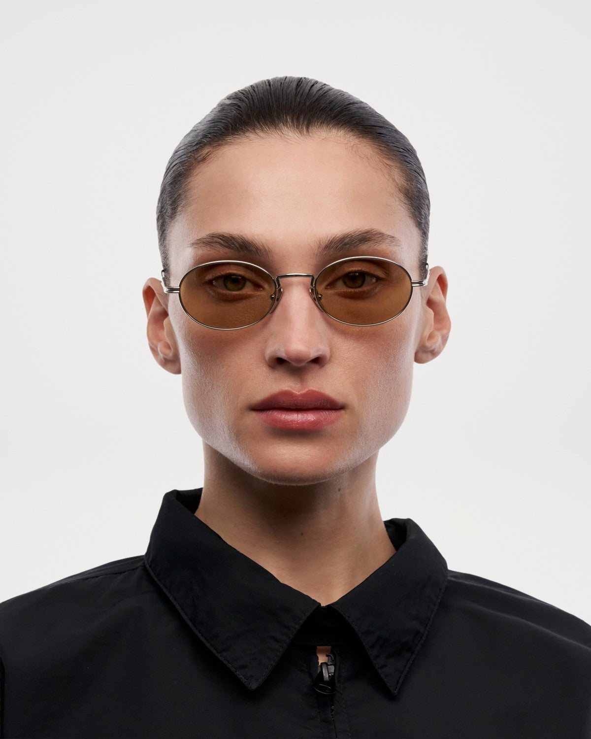 Model wearing CHIMI CC Titan Oval Silver sunglasses.
