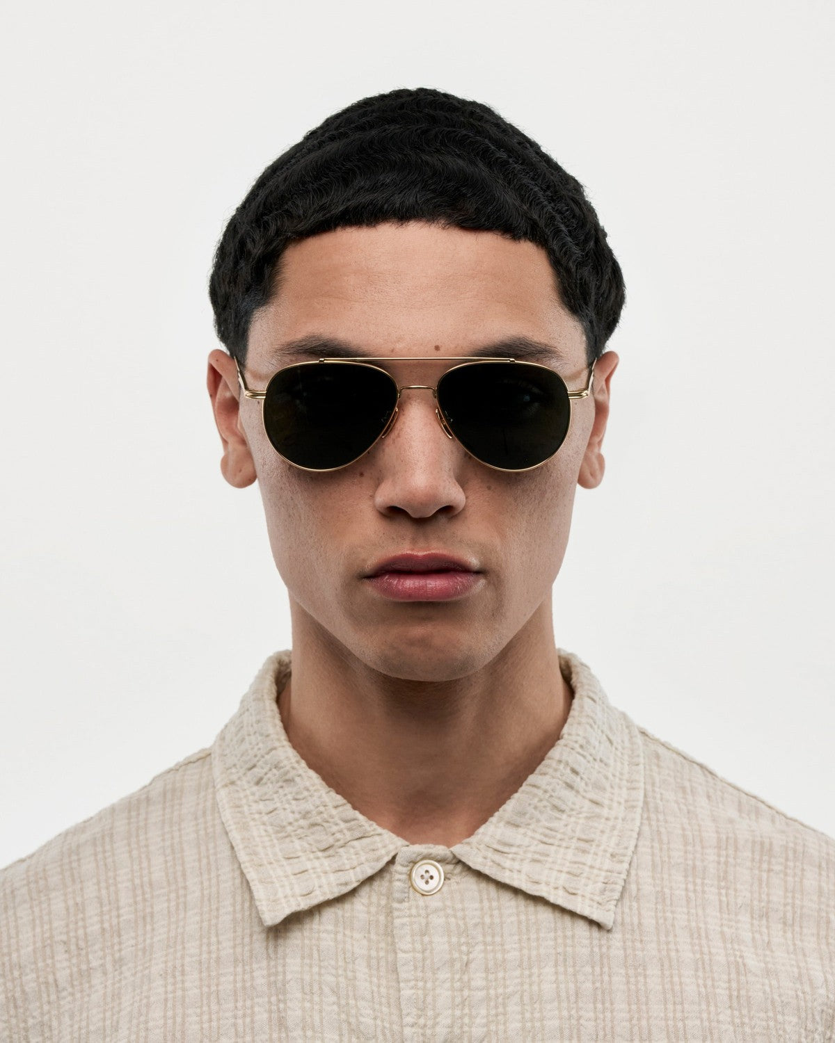 Model wearing CHIMI CC Titan Pilot Gold Brown sunglasses.