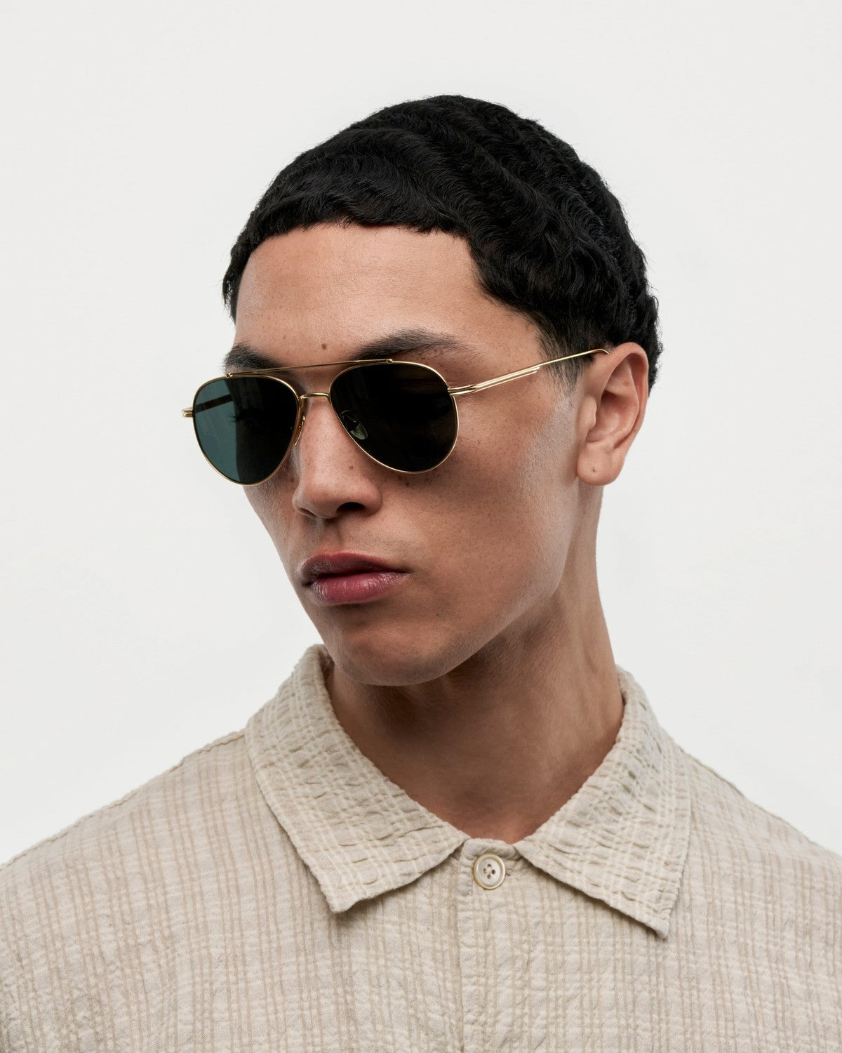 Side profile of model wearing CHIMI CC Titan Pilot Gold Brown sunglasses.