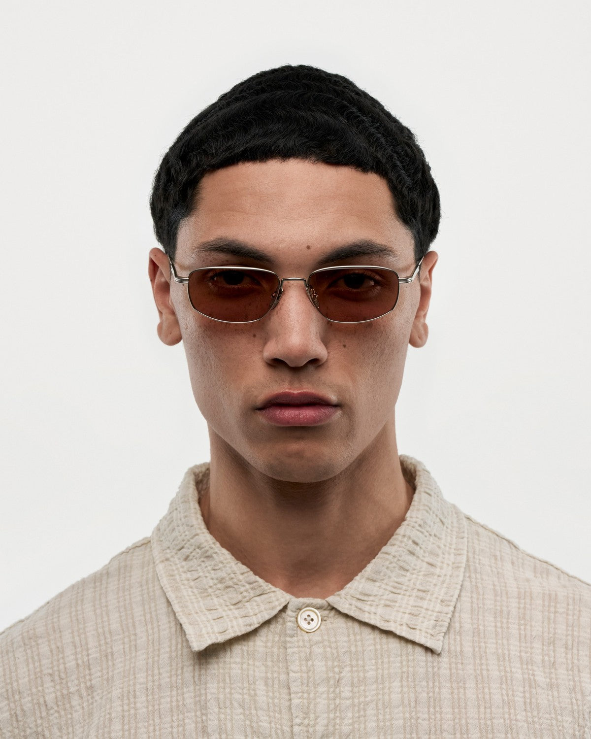 Model wearing CHIMI CC Titan Plane Silver sunglasses.