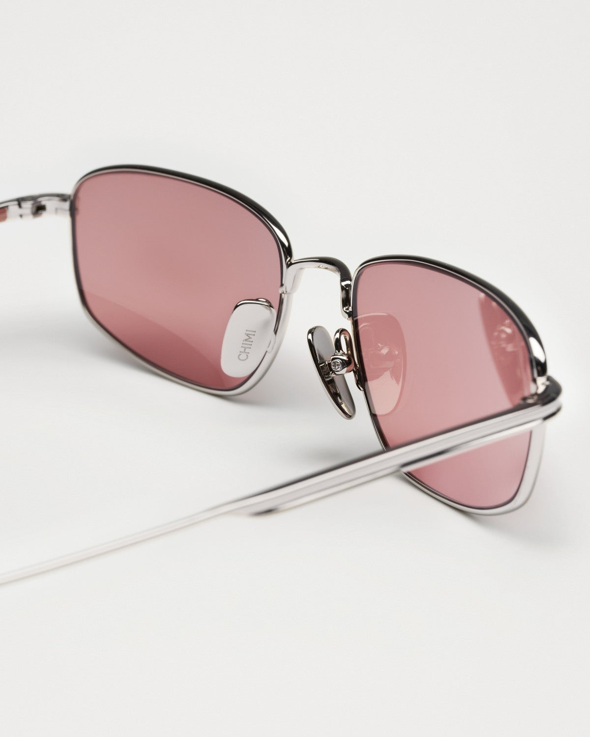 Close-up of the bridge and nose pads on CHIMI CC Titan Plane Silver sunglasses.