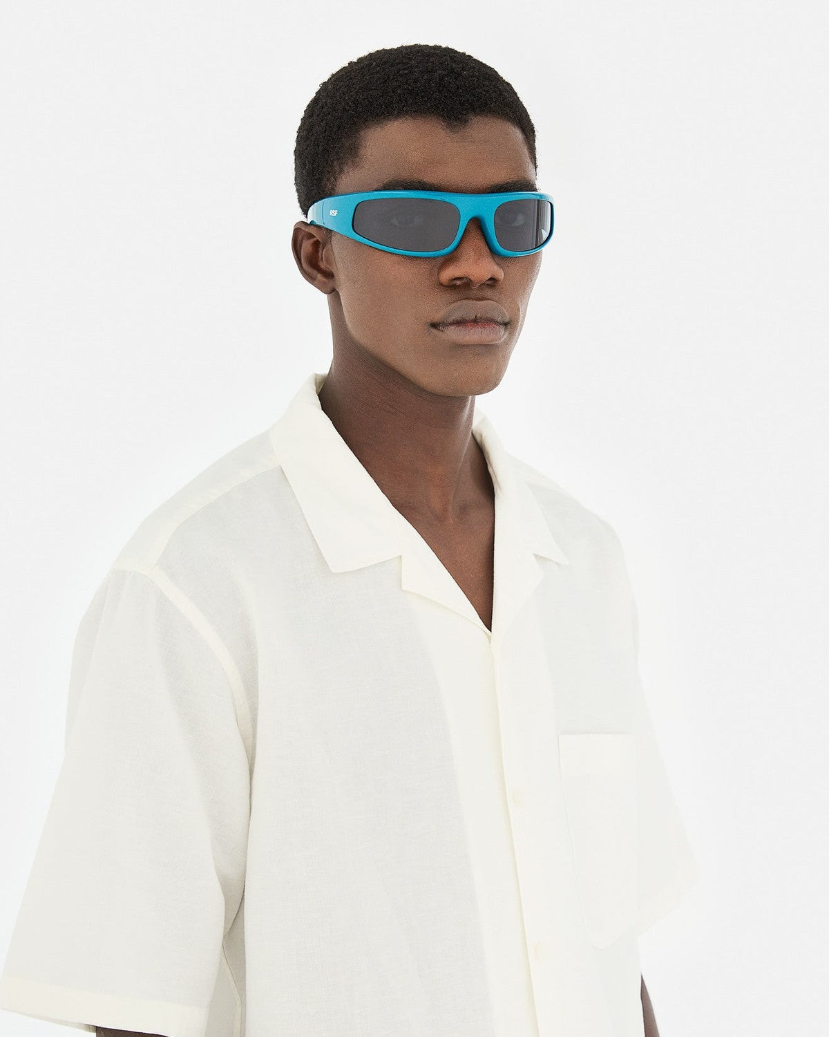 Model wearing RETROSUPERFUTURE Cerchietto Alzavolo sunglasses, side view.
