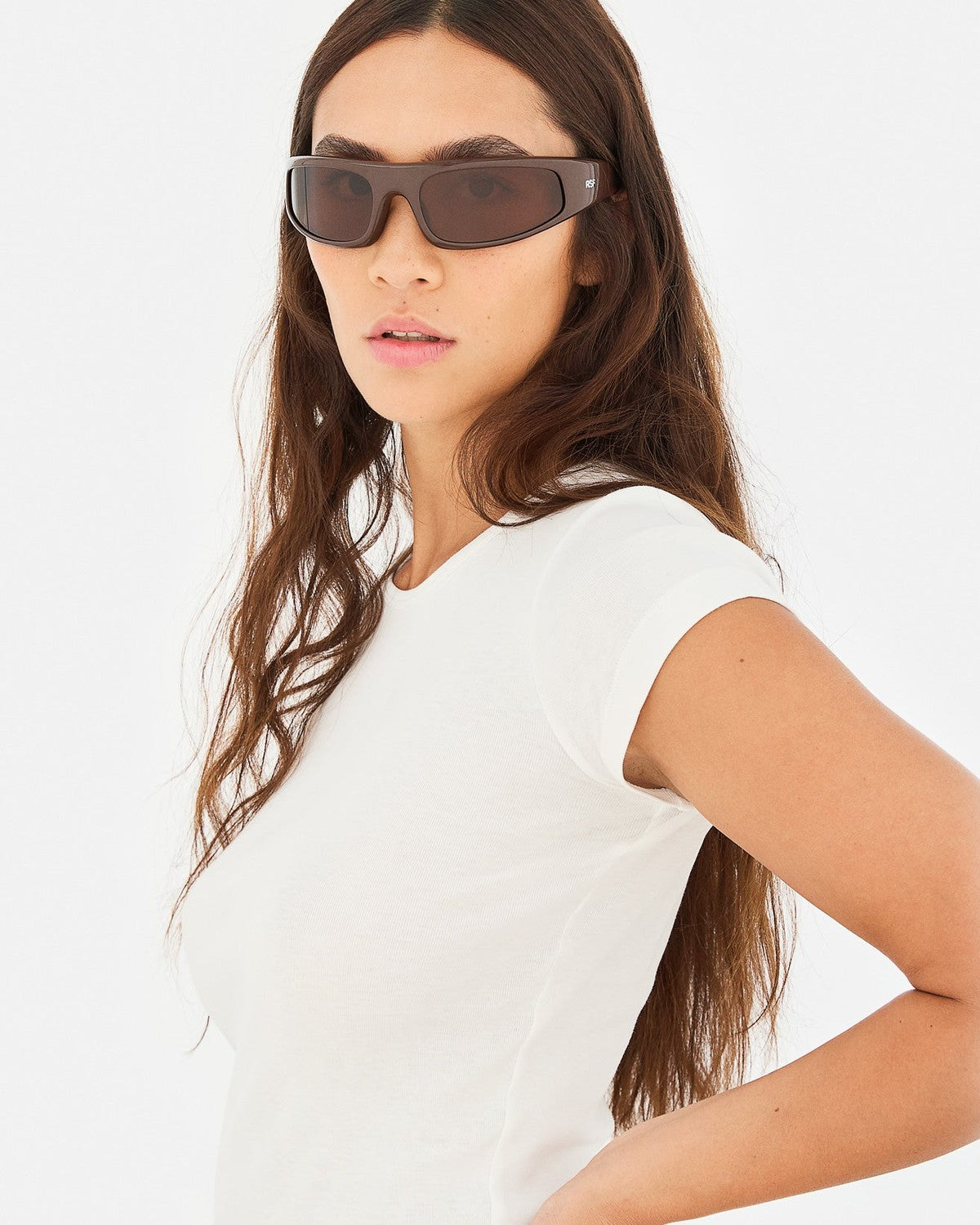 Model wearing RETROSUPERFUTURE Cerchietto Ciambella eyeglasses with white top.