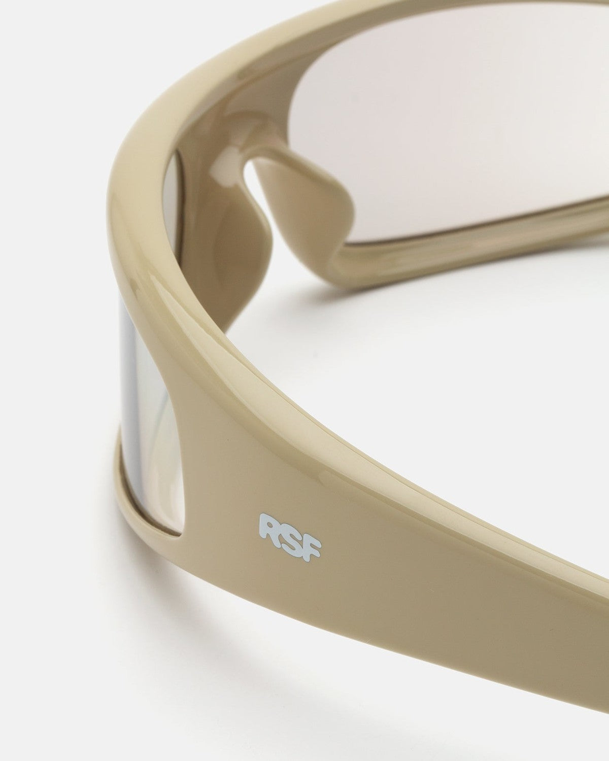 Detail of the frame construction and logo on RETROSUPERFUTURE Cerchietto Cremoso sunglasses.