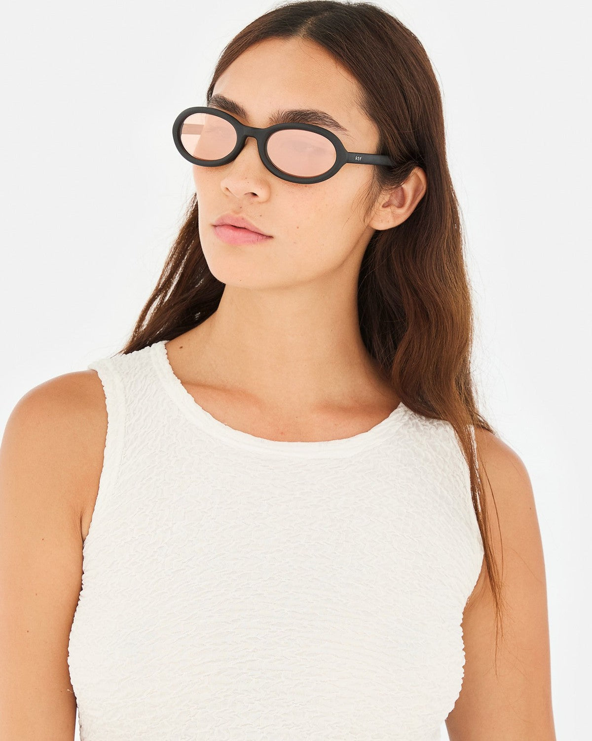Model wearing RETROSUPERFUTURE Cherry Black Matte sunglasses.