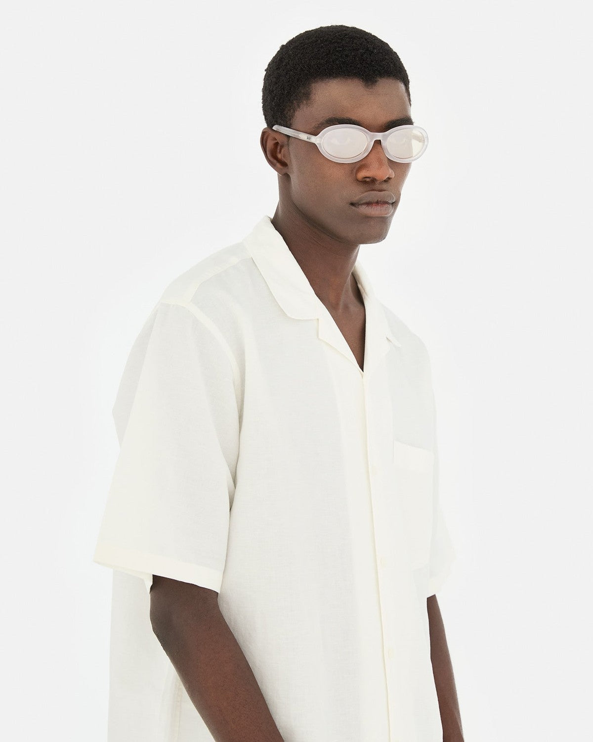 Side profile of model wearing RETROSUPERFUTURE Cherry Frozen sunglasses.