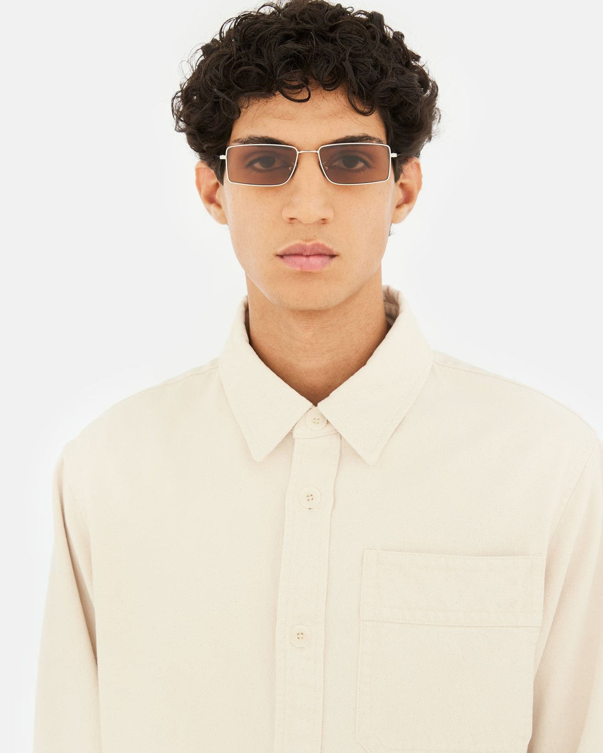 Model wearing RETROSUPERFUTURE Chopper Brown Marble sunglasses in a front-facing portrait.