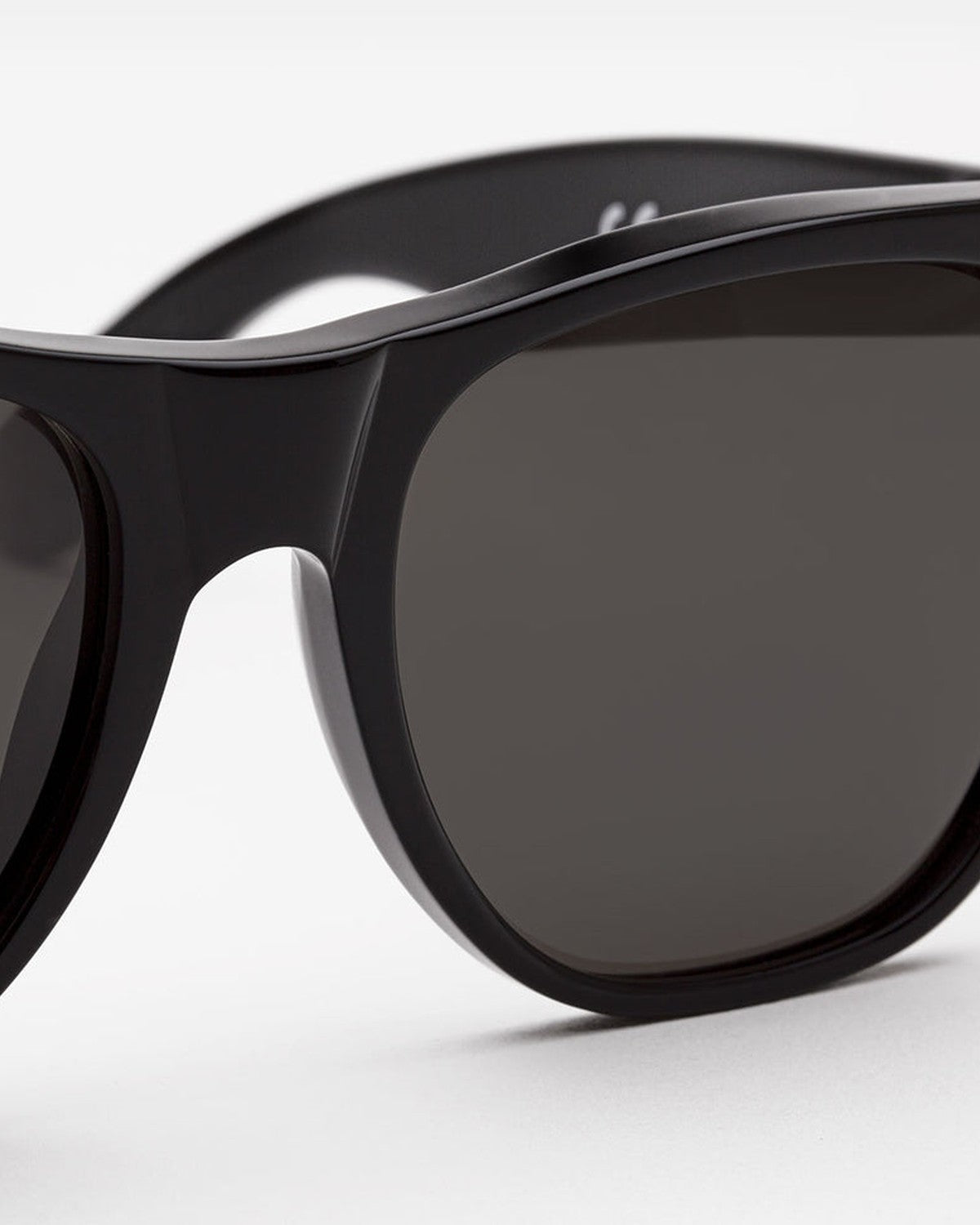 Close-up of the bridge and lens on RETROSUPERFUTURE Classic Black sunglasses.