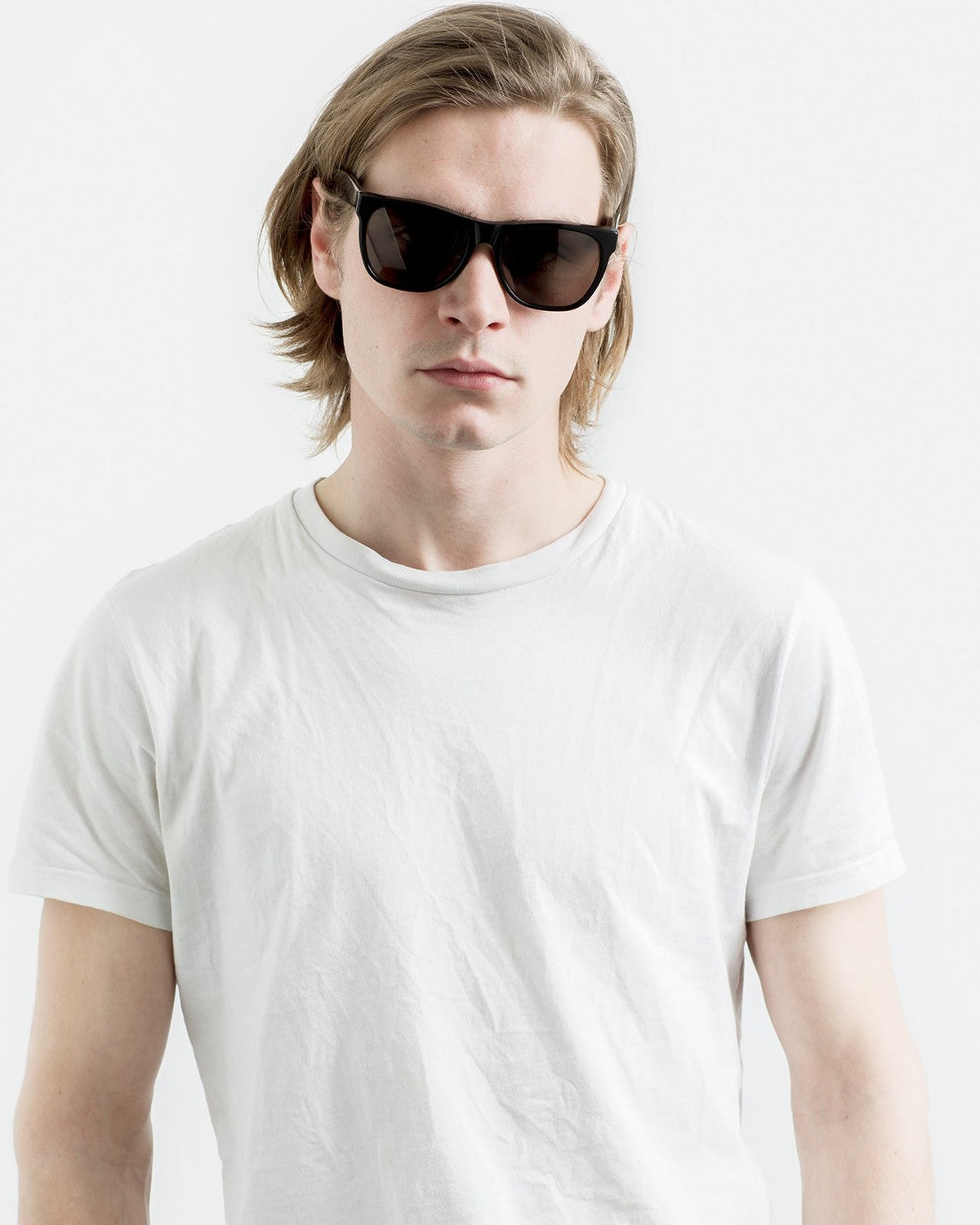 Front view of model wearing RETROSUPERFUTURE Classic Black sunglasses.