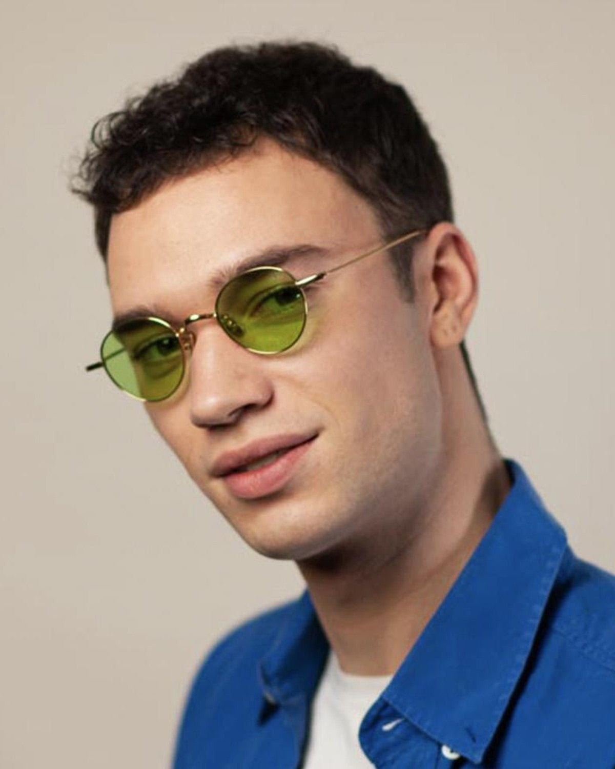 Model wearing EYEPETIZER CLINT C.4-1 sunglasses in a blue collared shirt.