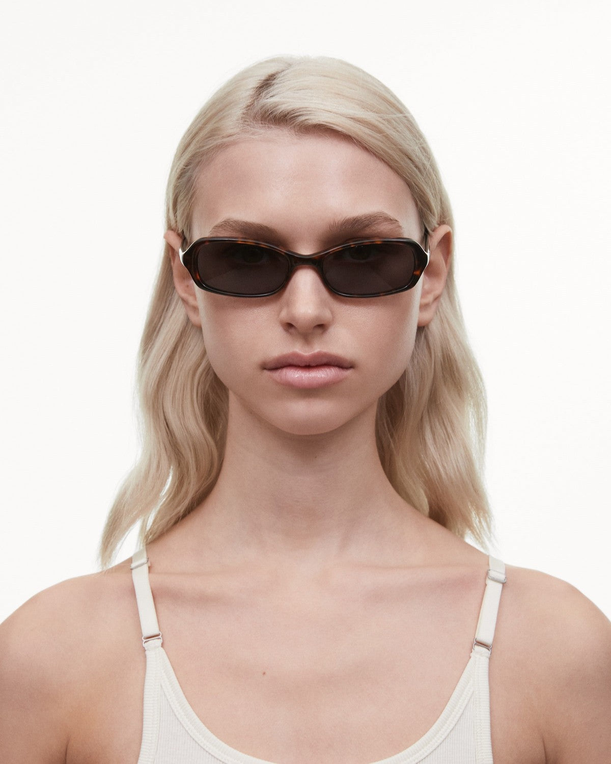 Model wearing CHIMI Code Tortoise sunglasses, front view.