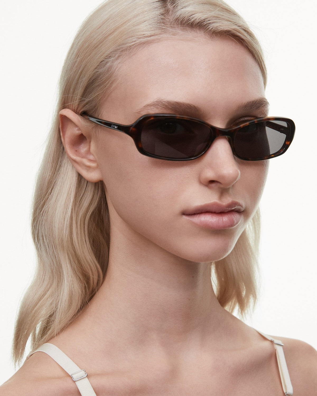 Angled view of model wearing CHIMI Code Tortoise sunglasses.