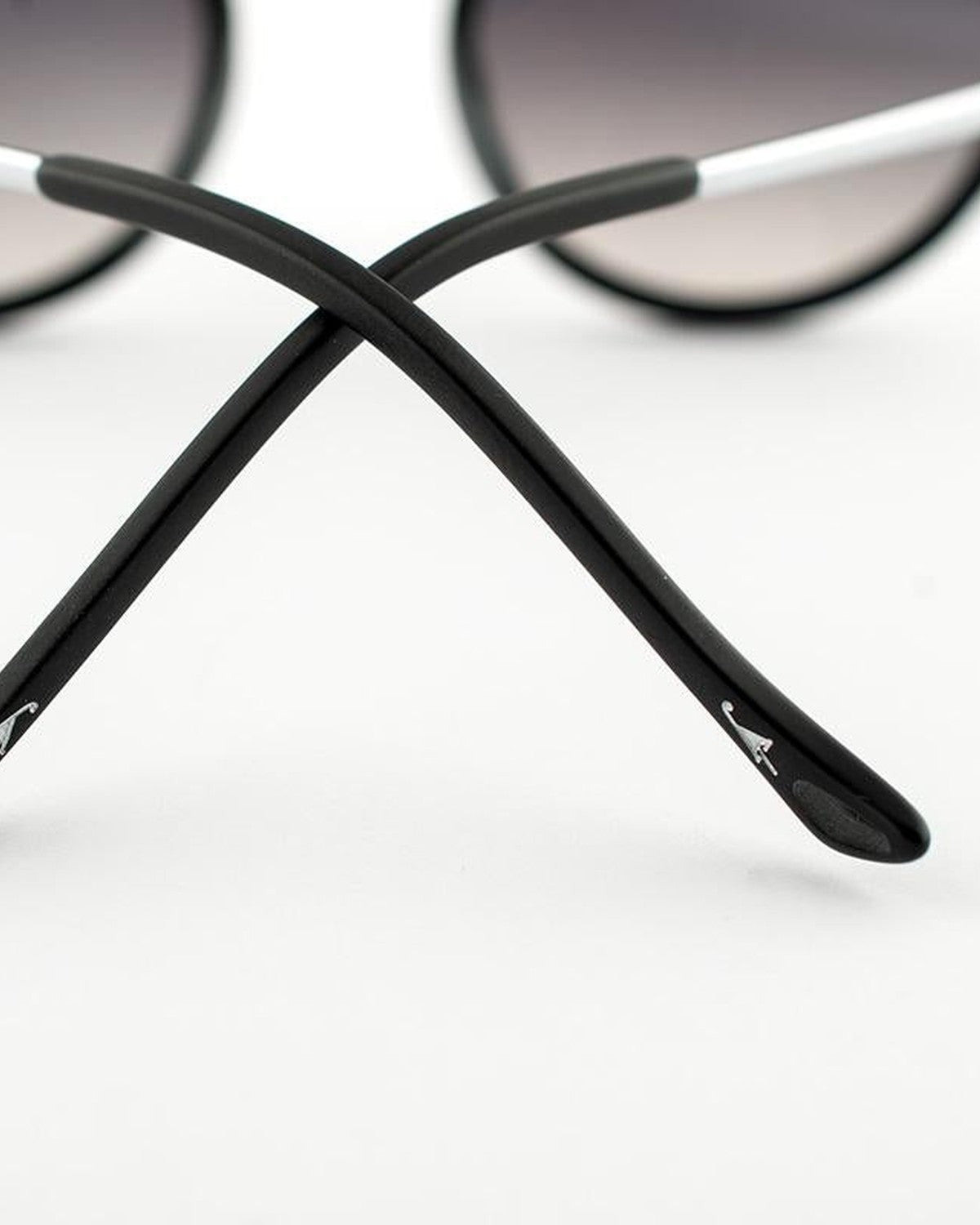 Detail of the crossed temples showing the curved tips of EYEPETIZER DES ART C.A-1-27F sunglasses.